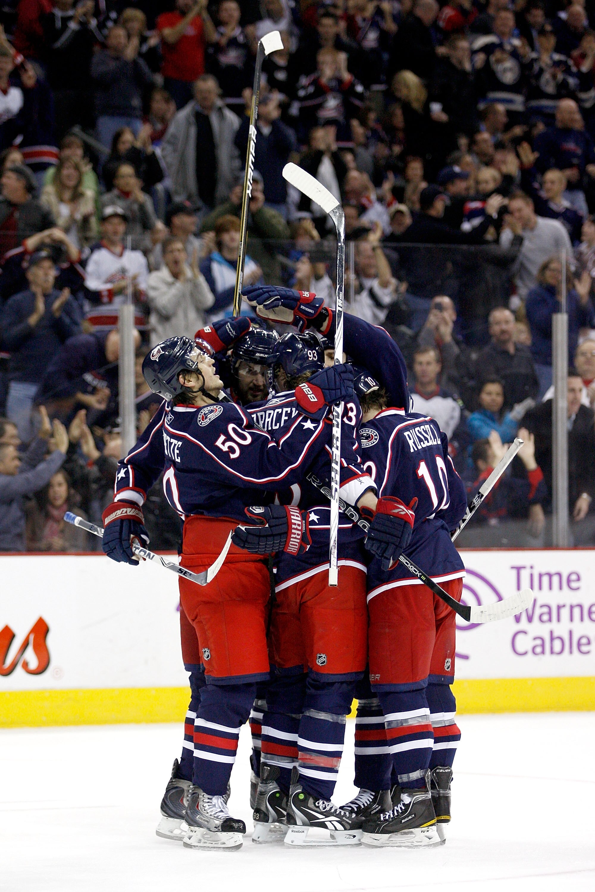 COLUMBUS,OH - DECEMBER 11:  Antoine Vermette #50 of the Columbus Blue Jackets celebrates with his teammates after tying the game on a power play goal during the second period against the New York Rangers on December 11, 2010 at Nationwide Arena in Columbu