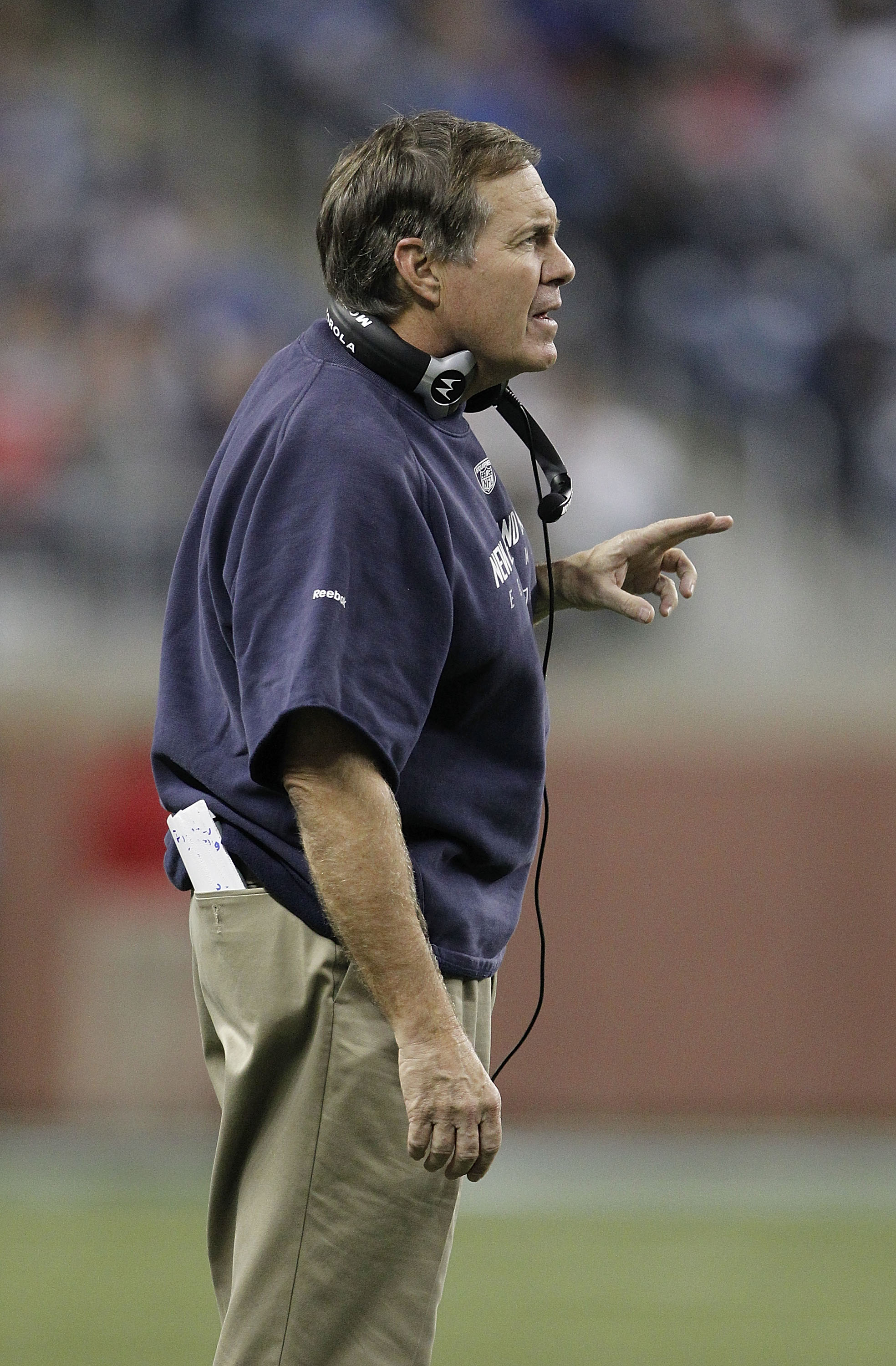 DETROIT - NOVEMBER 25: New England Patriots head coach Bill Belichick looks on during the game against the Detroit Lions at Ford Field on November 25, 2010 in Detroit, Michigan. New England defeated Detroit 45-24.  (Photo by Leon Halip/Getty Images)