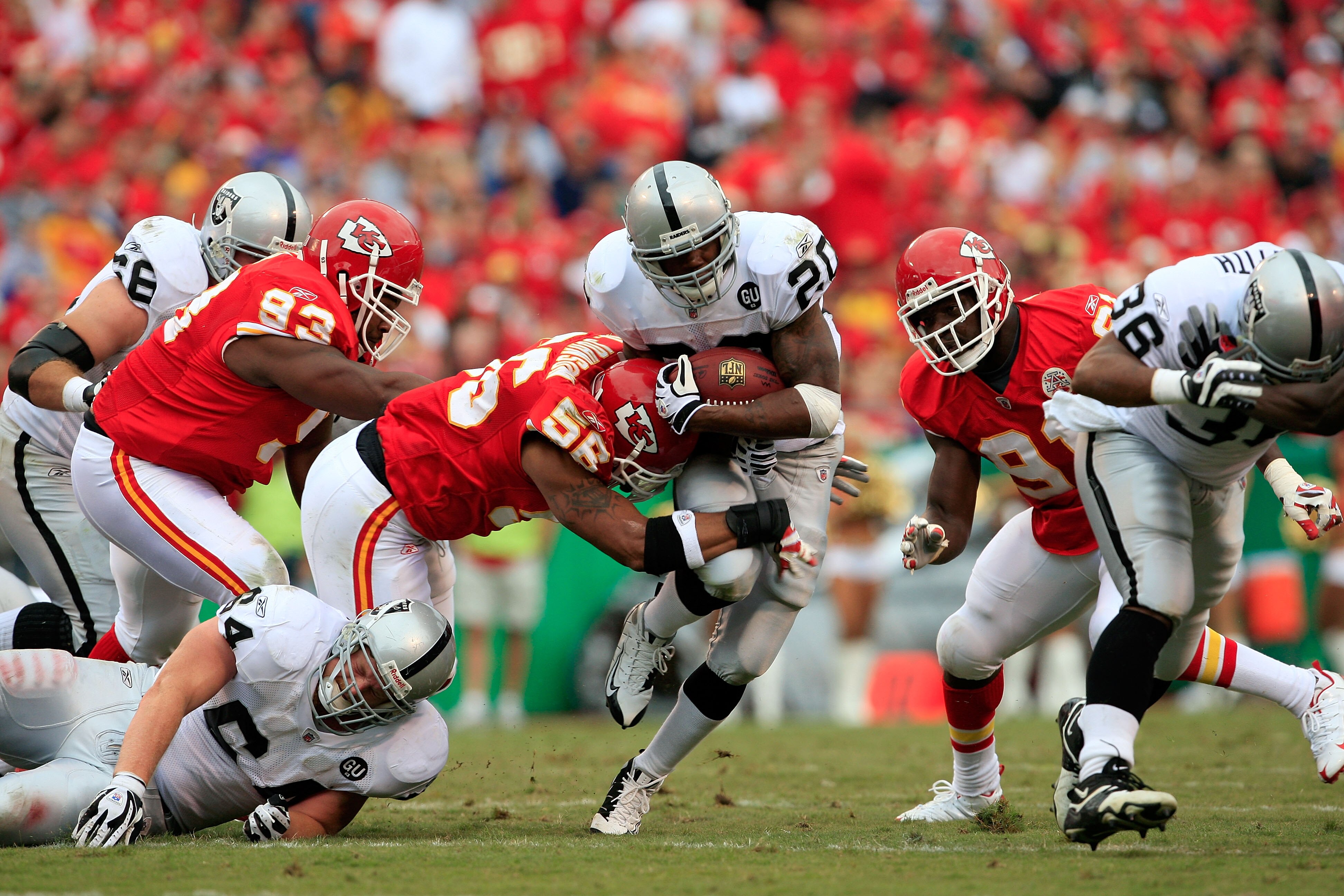 KANSAS CITY, MO - SEPTEMBER 14:  Darren McFadden #20 of the Oakland Raiders carries the ball as Derrick Johnson #56 of the Kansas City Chiefs defends during the first half fo the game on September 14, 2008 at Arrowhead Stadium in Kansas City, Missouri.  (