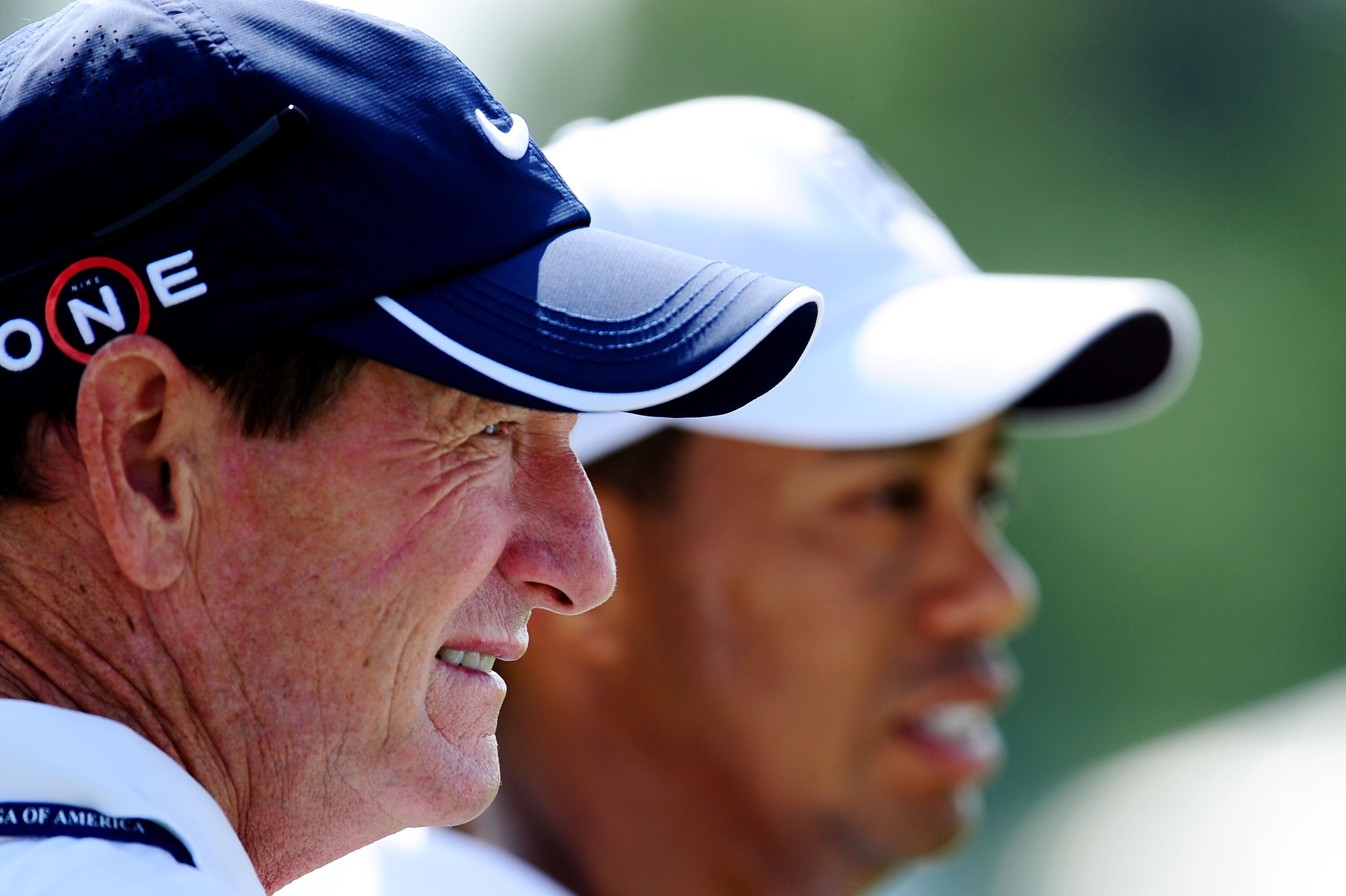 CHASKA, MN - AUGUST 12:  (L-R) Swing coach Hank Haney and Tiger Woods look on during the third preview day of the 91st PGA Championship at Hazeltine National Golf Club on August 12, 2009 in Chaska, Minnesota.  (Photo by Stuart Franklin/Getty Images)