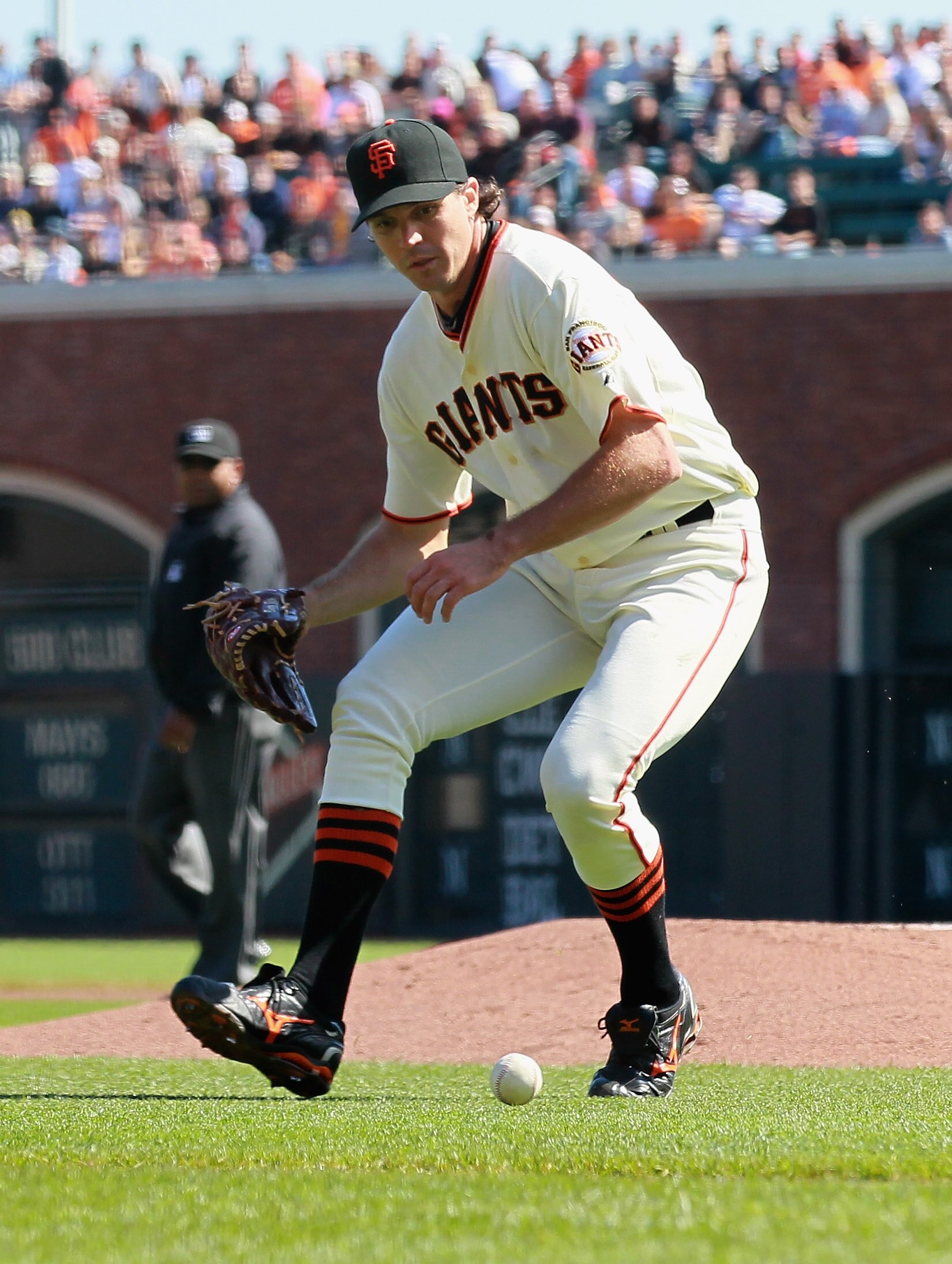SAN FRANCISCO - OCTOBER 02:  Barry Zito #75 of the San Francisco Giants fields a bunt off the bat of Miguel Tejada #10 of the San Diego Padres during the first inning at AT&T Park on October 2, 2010 in San Francisco, California.  (Photo by Justin Sullivan