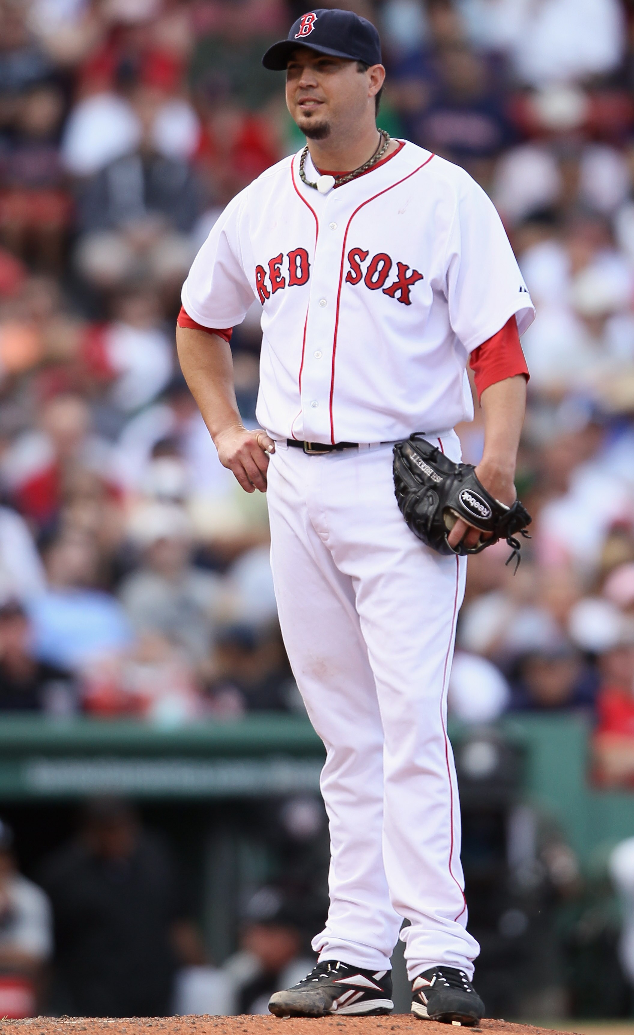 BOSTON - SEPTEMBER 05: Josh Beckett #19  of the Boston Red Sox reacts after walking Alex Rios of the Chicago White Sox in the seventh inning on September 5, 2010 at Fenway Park in Boston, Massachusetts.  (Photo by Elsa/Getty Images)