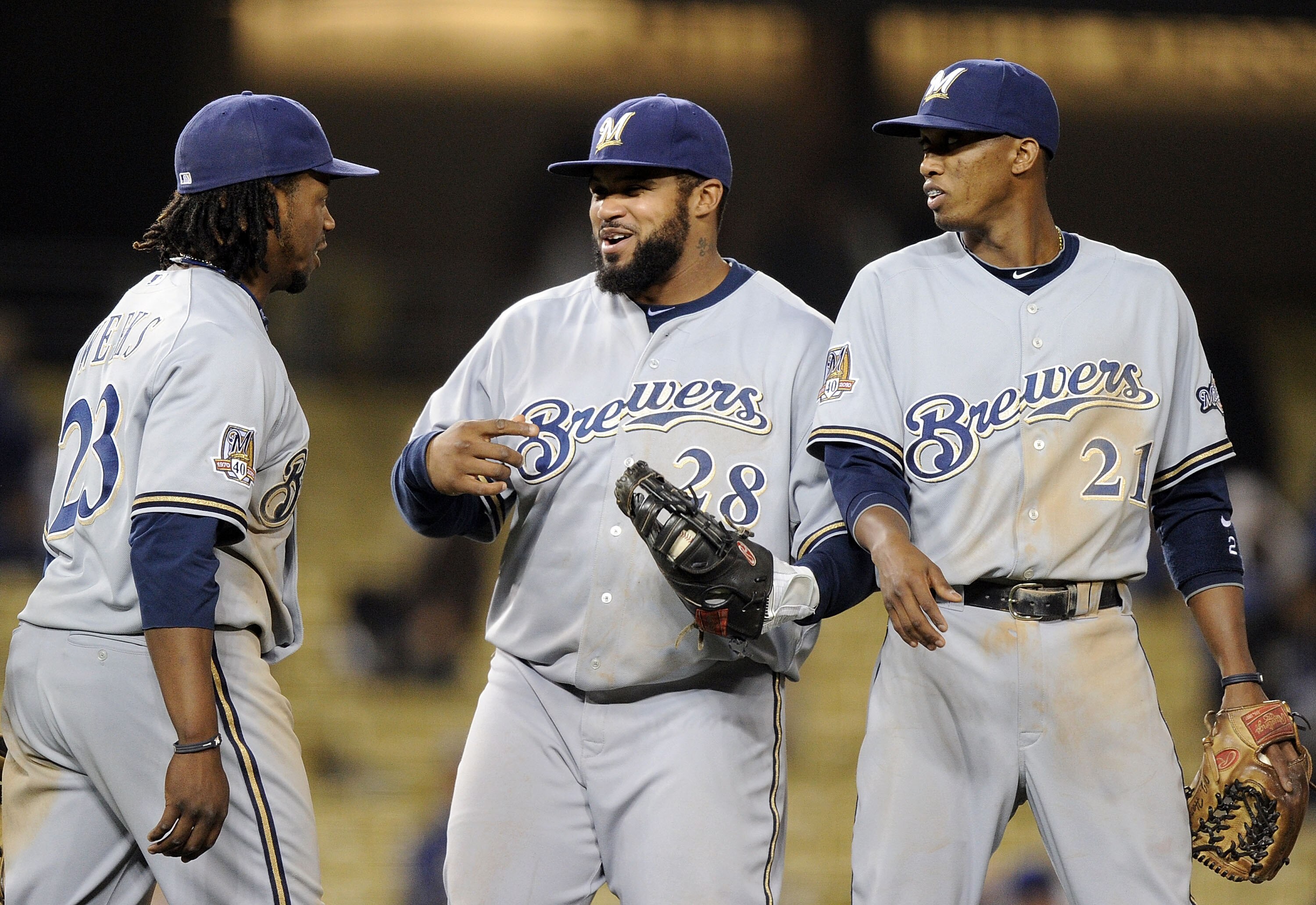 LOS ANGELES, CA - MAY 05:  Prince Fielder #28, Alcides Escobar #21 and Rickie Weeks #23 of the Milwaukee Brewers celebrate a 11-3 win over the Los Angeles Dodgers at Dodger Stadium on May 5, 2010 in Los Angeles, California.  (Photo by Harry How/Getty Imag