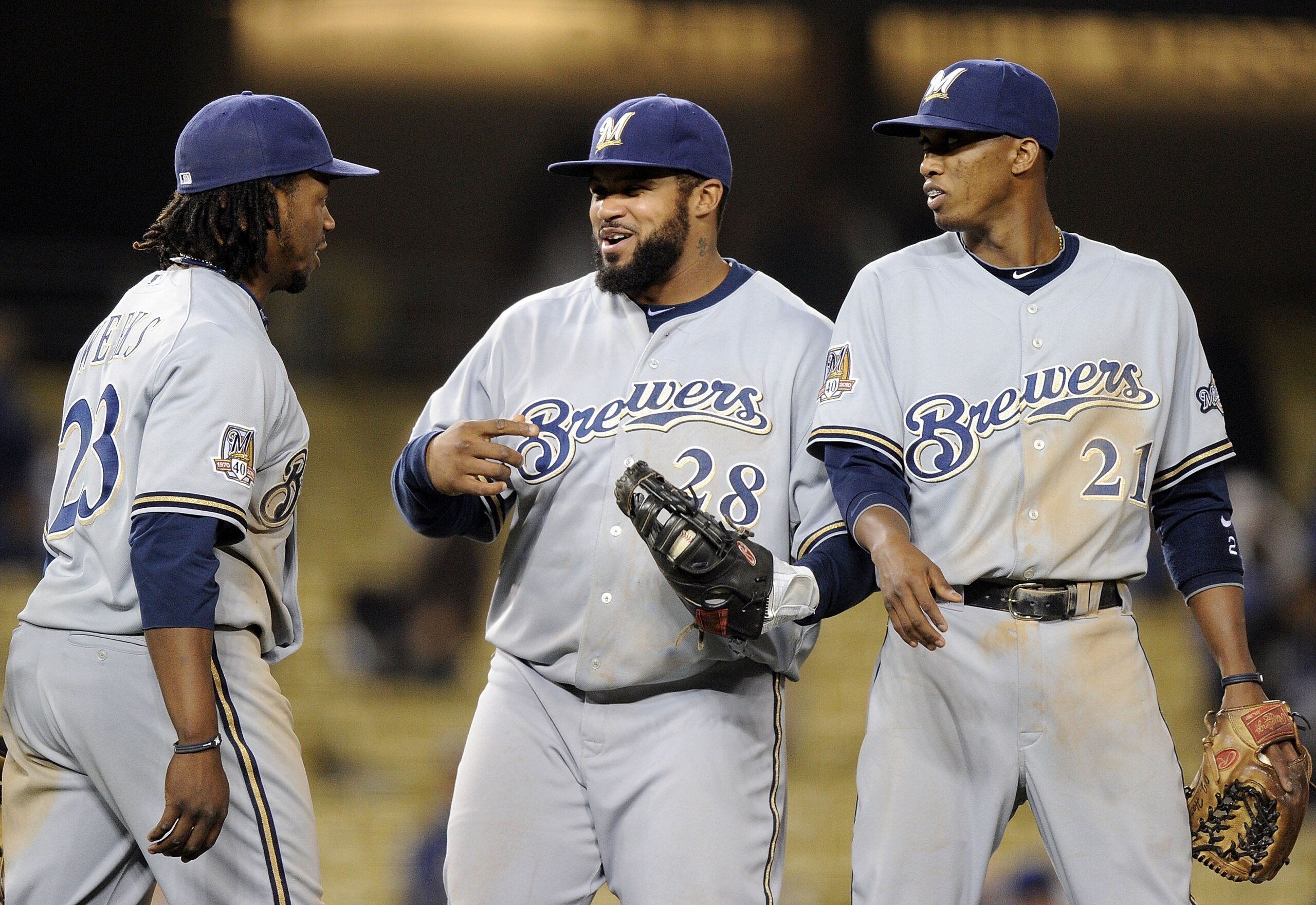 LOS ANGELES, CA - MAY 05:  Prince Fielder #28, Alcides Escobar #21 and Rickie Weeks #23 of the Milwaukee Brewers celebrate a 11-3 win over the Los Angeles Dodgers at Dodger Stadium on May 5, 2010 in Los Angeles, California.  (Photo by Harry How/Getty Imag