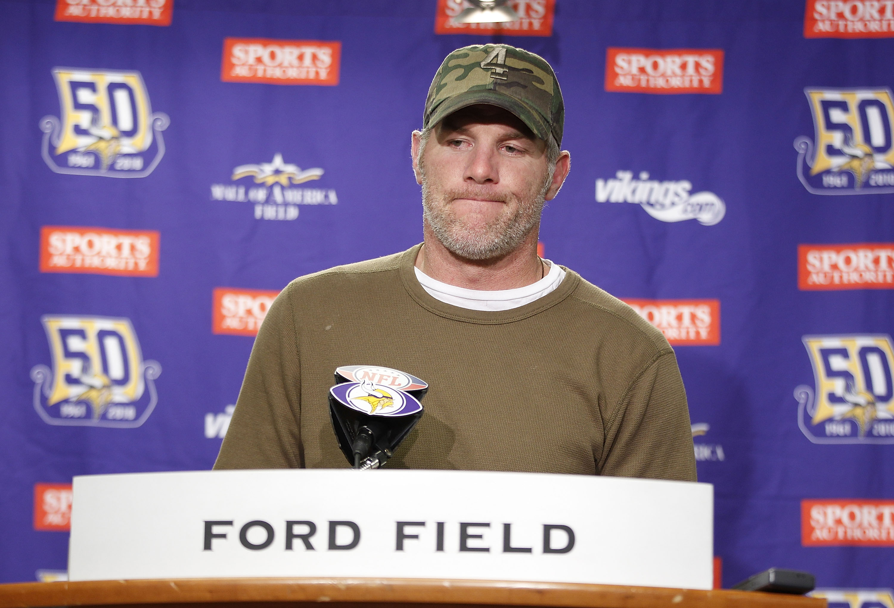DETROIT, MI - DECEMBER 13:  Brett Favre #4 of the Minnesota Vikings talks to the media after the game against the New York Giants at Ford Field on December 13, 2010 in Detroit, Michigan. The Giants defeated the Vikings 21-3.  (Photo by Leon Halip/Getty Im
