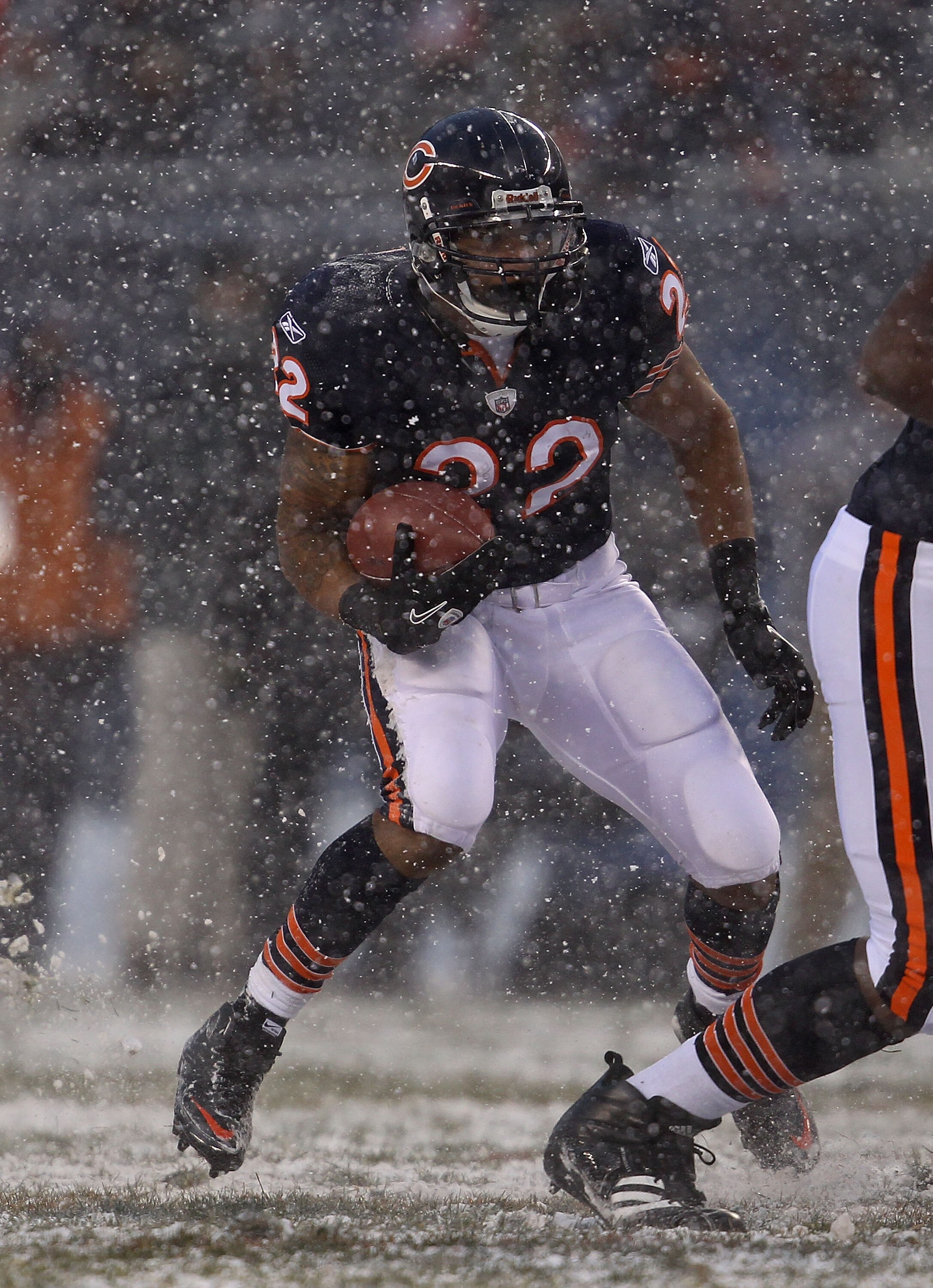 CHICAGO, IL - DECEMBER 12: Matt Forte #22 of the Chicago Bears looks for running room against the New England Patriots at Soldier Field on December 12, 2010 in Chicago, Illinois. The Patriots defeated the Bears 36-7. (Photo by Jonathan Daniel/Getty Images