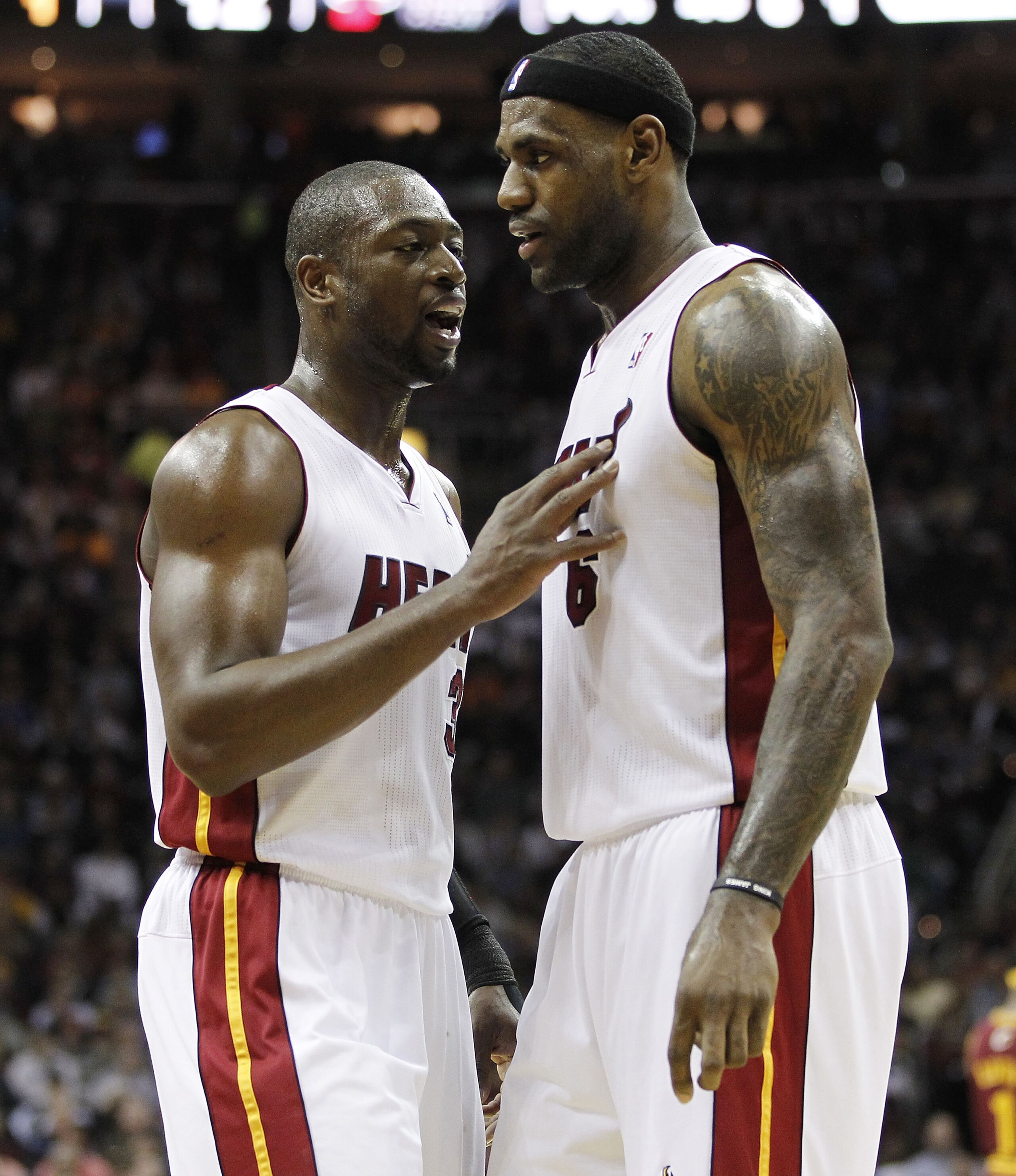 CLEVELAND, OH - DECEMBER 02:  LeBron James #6 of the Miami Heat talks to Dwyane Wade #3 while playing the Cleveland Cavaliers at Quicken Loans Arena on December 2, 2010 in Cleveland, Ohio. NOTE TO USER: User expressly acknowledges and agrees that, by down
