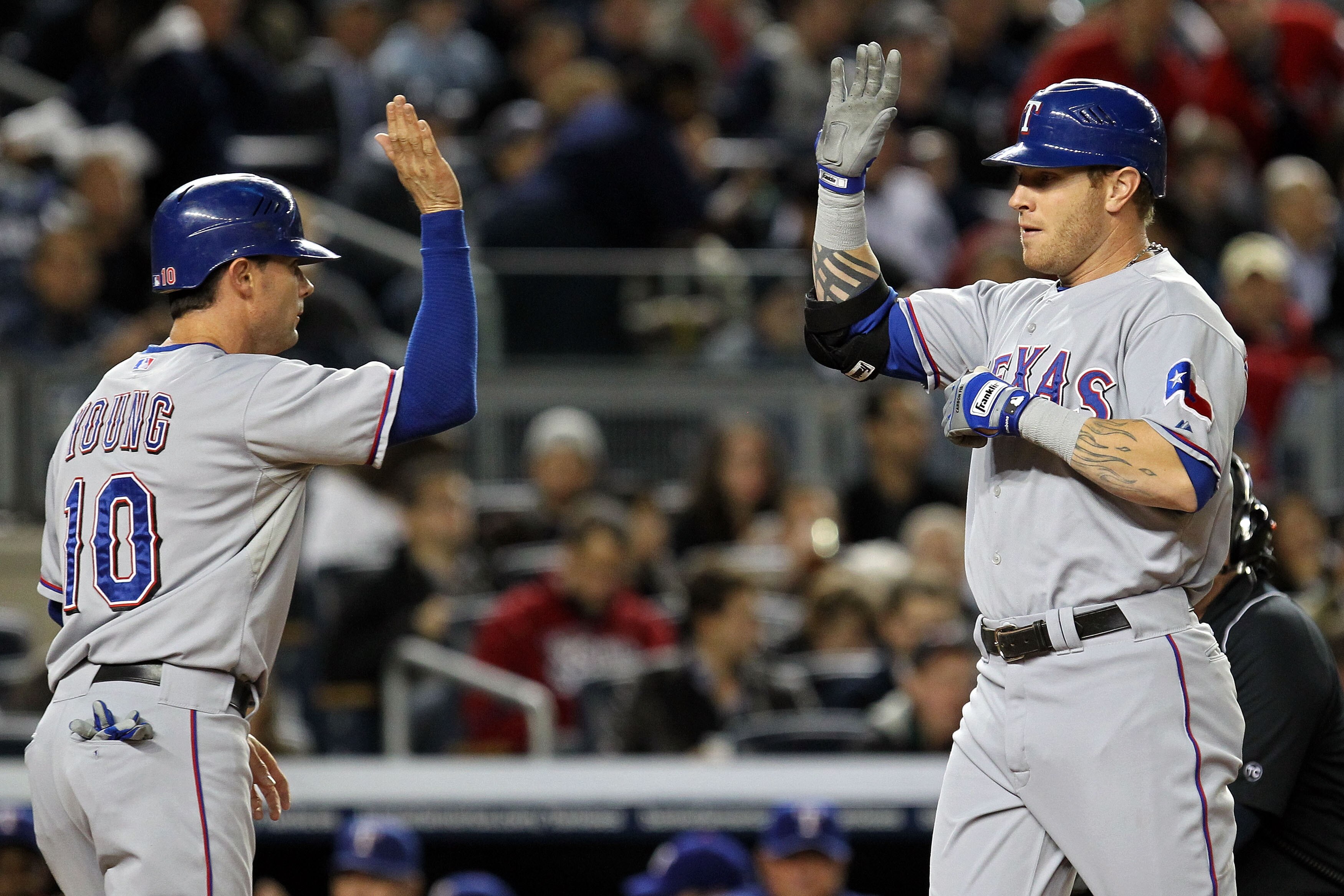 NEW YORK - OCTOBER 18: Josh Hamilton #32 of the Texas Rangers celebrates with Michael Young #10 after hitting a two run homerun in the first inning against the New York Yankeesin Game Three of the ALCS during the 2010 MLB Playoffs at Yankee Stadium on Oct