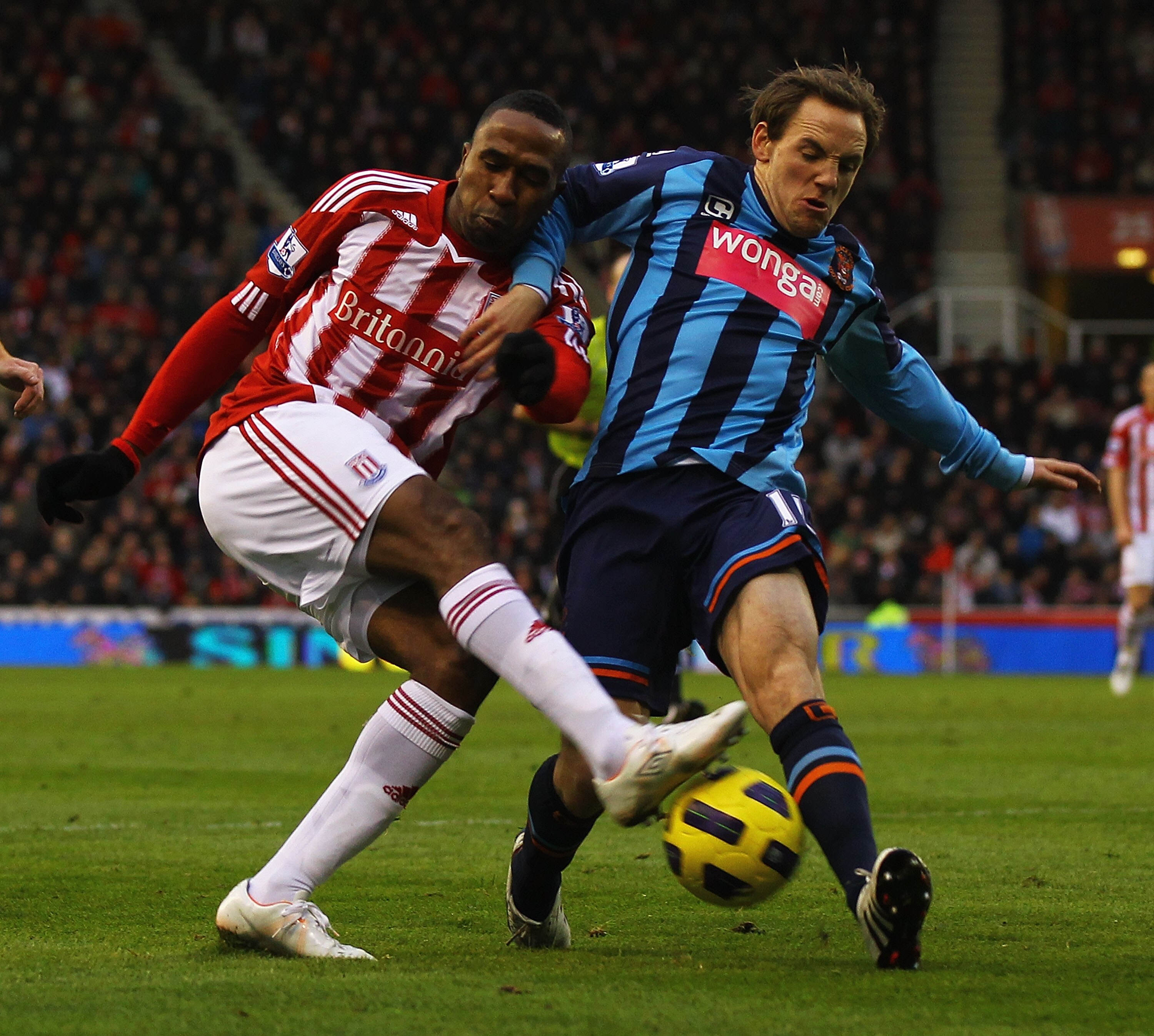 STOKE ON TRENT, ENGLAND - DECEMBER 11:  Ricardo Fuller of Stoke and David Vaughan of Blackpool challenge for the ball during the Barclays Premier League match between Stoke City and Blackpool at Britannia Stadium on December 11, 2010 in Stoke on Trent, En