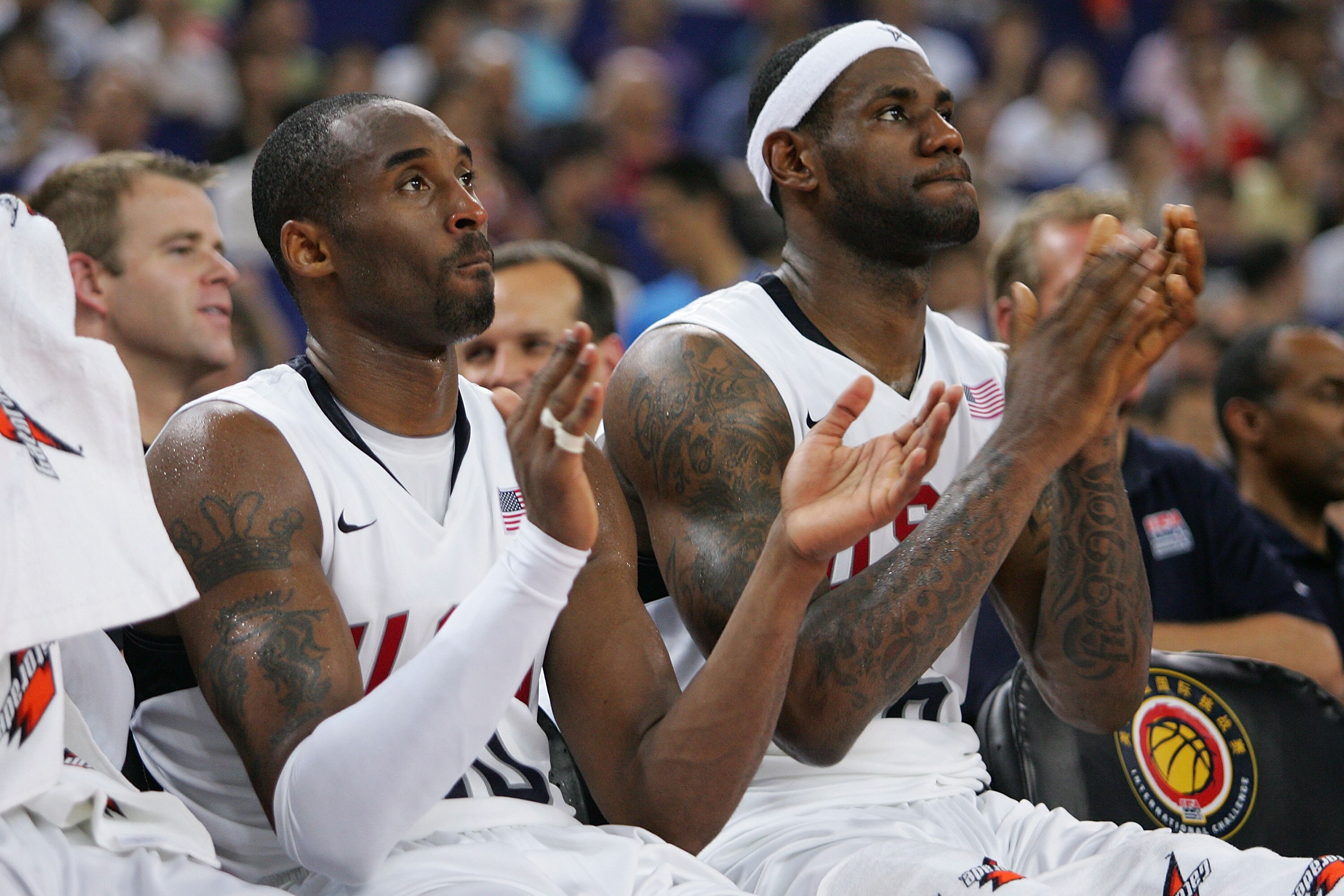 SHANGHAI, CHINA - AUGUST 03:  Kobe Bryant #10 and LeBron James #6 of the USA Basketball Men's Senior National Team look on during the USA Basketball International Challenge exhibition game against the Russian National Team at the Qizhong Arena on August 3