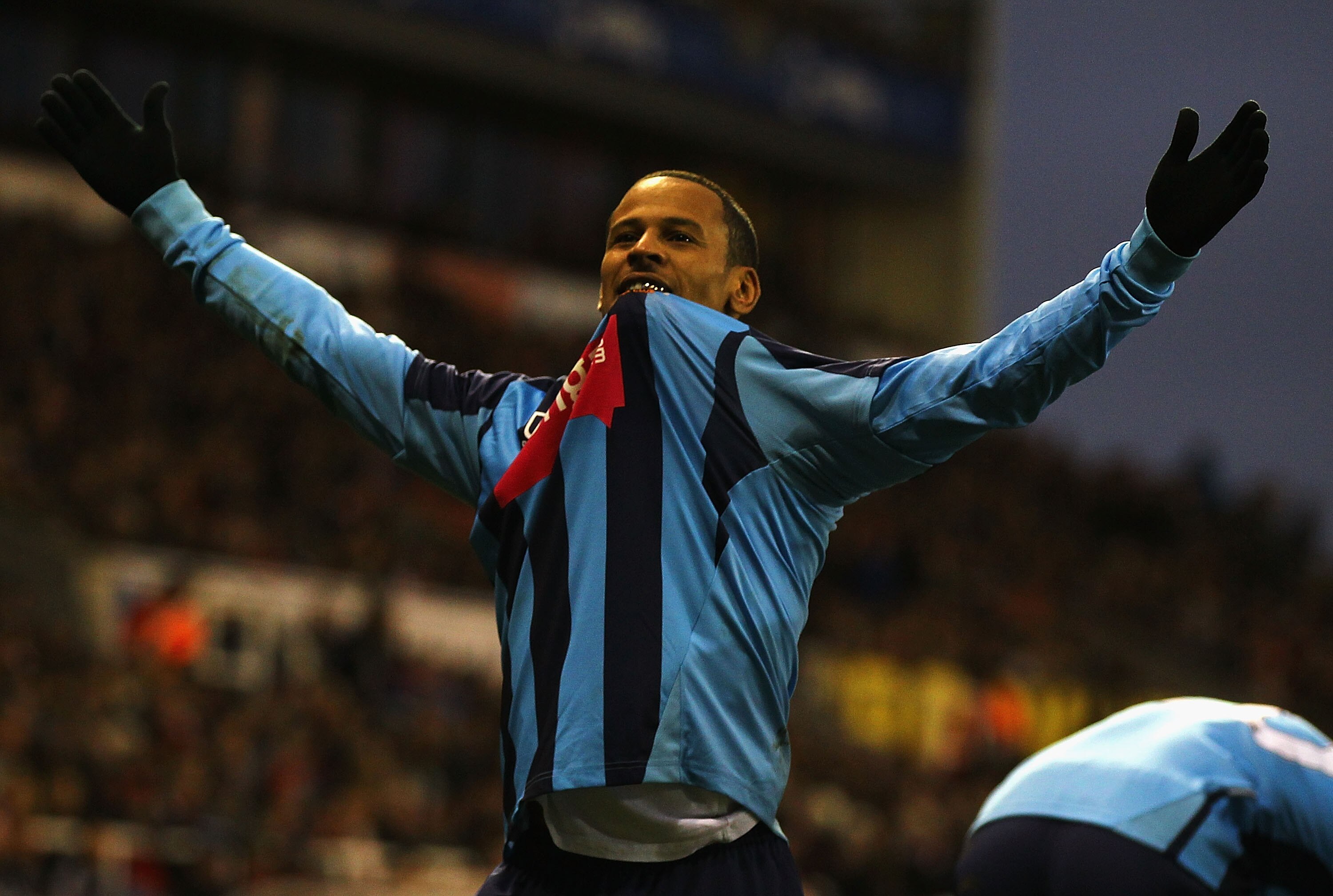 STOKE ON TRENT, ENGLAND - DECEMBER 11:  DJ Campbell of Blackpool celebrates his goal during the Barclays Premier League match between Stoke City and Blackpool at Britannia Stadium on December 11, 2010 in Stoke on Trent, England.  (Photo by Matthew Lewis/G