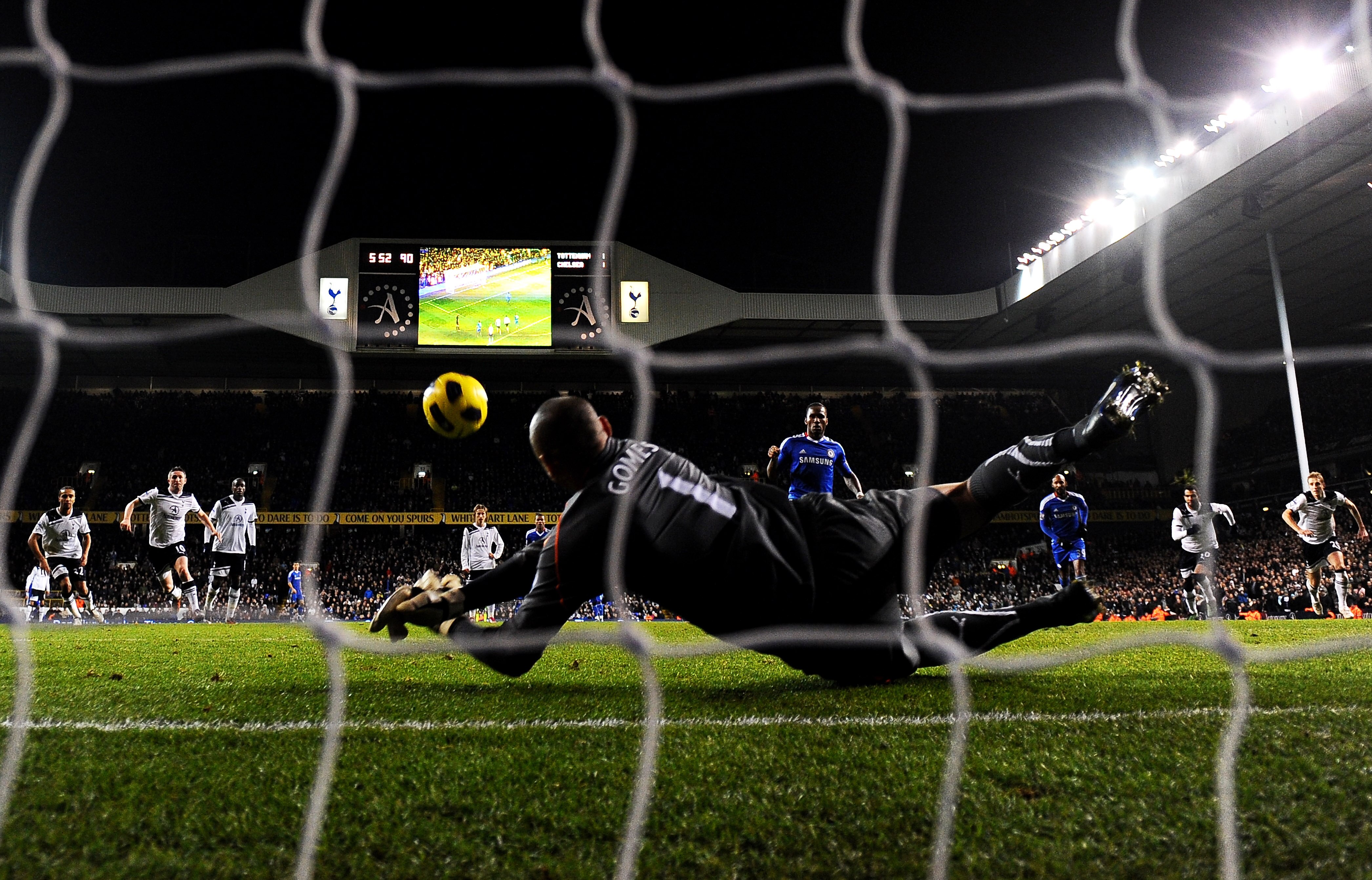 LONDON, ENGLAND - DECEMBER 12: Goalkeeper Heurelho Gomes of Spurs saves the penalty from Didier Drogba of Chelsea to keep the score at 1-1 during the Barclays Premier League match between Tottenham Hotspur and Chelsea at White Hart Lane on December 12, 20