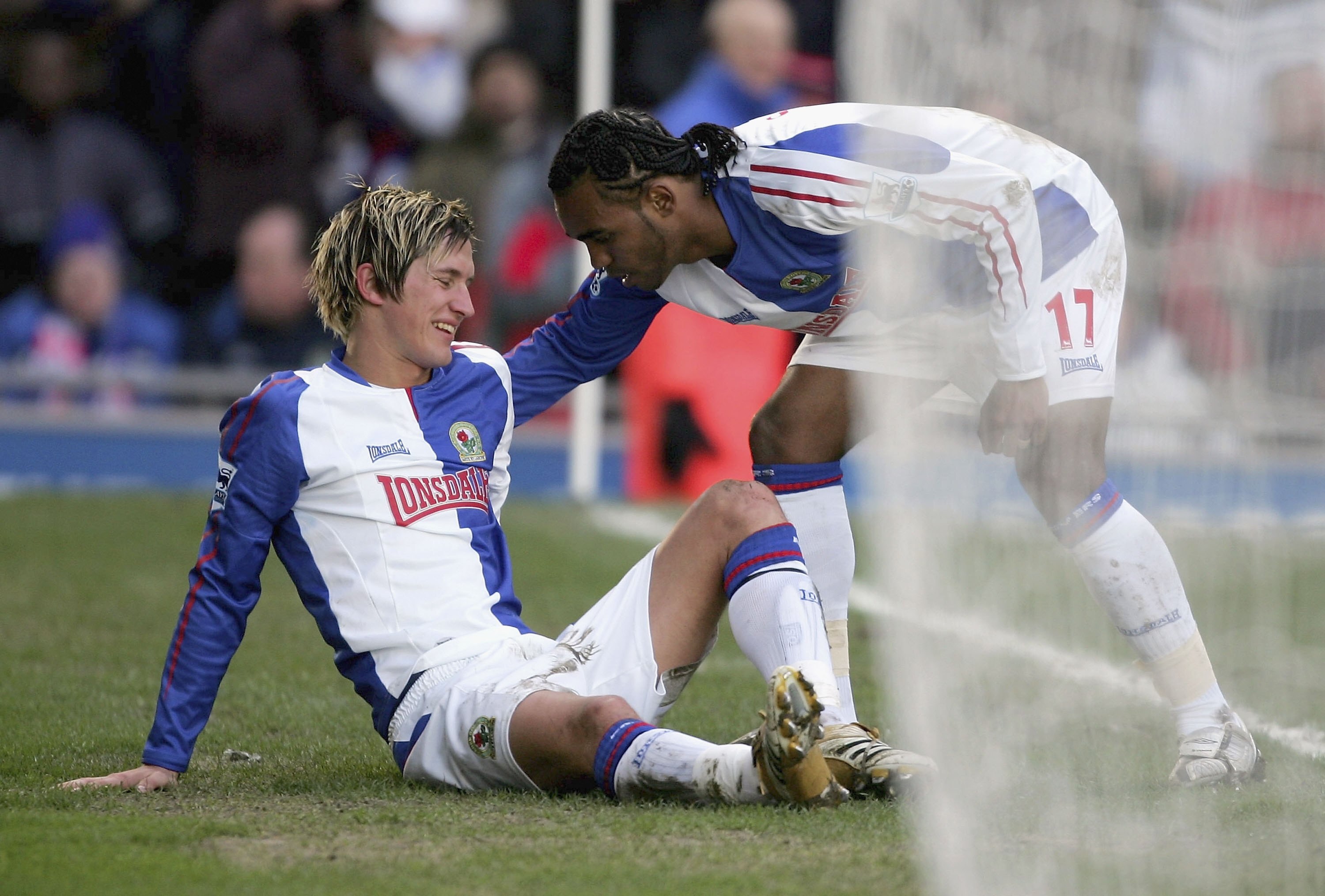 BLACKBURN, UNITED KINGDOM - FEBRUARY 25:  Morten Gamst Pederson of Blackburn Rovers is congratulated by Florent Sinama Pongolle as he lies injured after scoring the winning goal during the Barclays Premiership match between Blackburn Rovers and Arsenal at