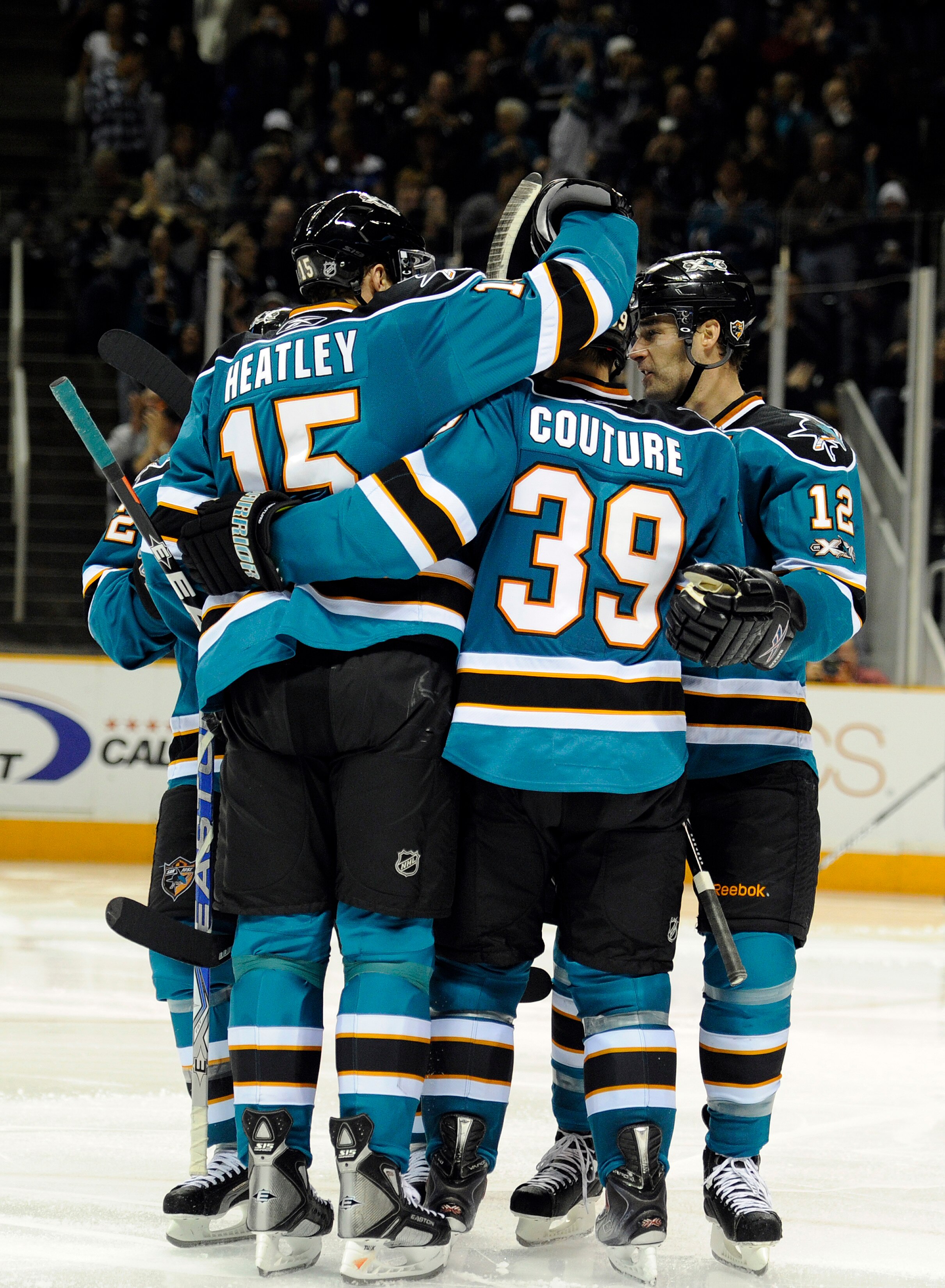 SAN JOSE, CA - NOVEMBER 6:  Logan Couture #39 of the San Jose Sharks celebrates his 5th goal of the year with teammates Patrick Marleau #12 and Dany Heatley #15 against Tampa Bay Lightning during an NHL hockey game at the HP Pavilion on November 6, 2010 i