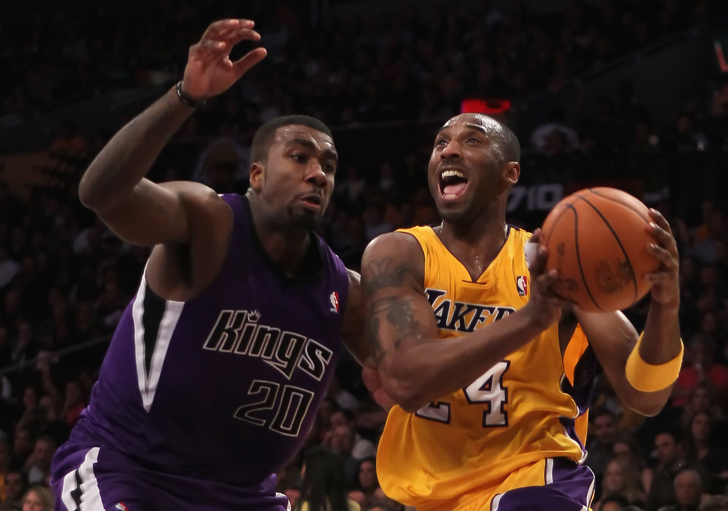 LOS ANGELES, CA - DECEMBER 03:  Kobe Bryant #24 of the Los Angeles Lakers is defended by Donte Greene #20 of the Sacramento Kings during the first half at Staples Center on December 3, 2010 in Los Angeles, California. NOTE TO USER: User expressly acknowle