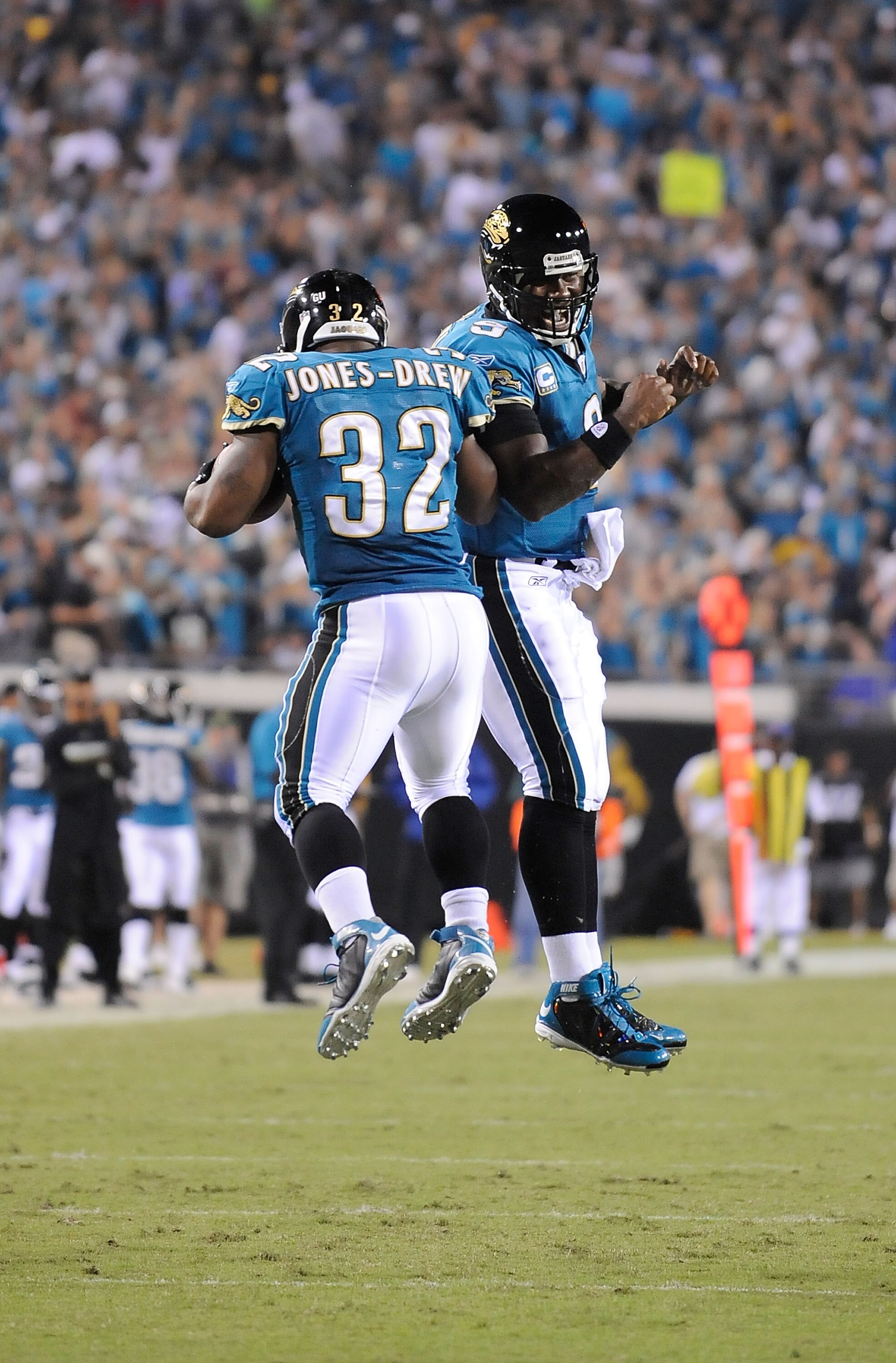 JACKSONVILLE, FL - OCTOBER 05:  David Garrard #9 and Maurice Jones-Drew #32 of the Jacksonville Jaguars celebrate after a touchdown in a game against the Pittsburgh Steelers at Jacksonville Municipal Stadium on October 5, 2008 in Jacksonville, Florida.  (