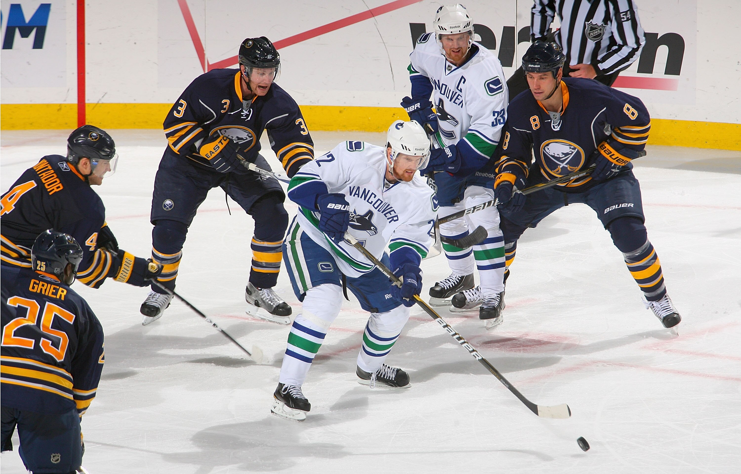 BUFFALO, NY - NOVEMBER 15: Daniel Sedin #22 and Henrik Sedin #33 of the Vancouver Canucks skate against  the Buffalo Sabres  at HSBC Arena on November 15, 2010 in Buffalo, New York. Buffalo won 4-3 in overtime.  (Photo by Rick Stewart/Getty Images)