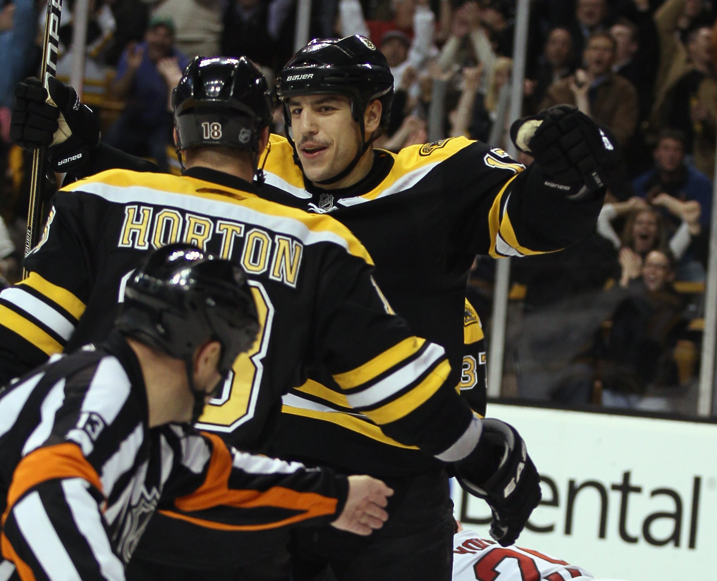 BOSTON - NOVEMBER 18: Milan Lucic #17 of the Boston Bruins is congratulated by teammate Nathan Horton #18 after Lucic scored a hat trick in the third period against the Florida Panthers on November 18, 2010 at the TD Garden in Boston, Massachusetts. The B