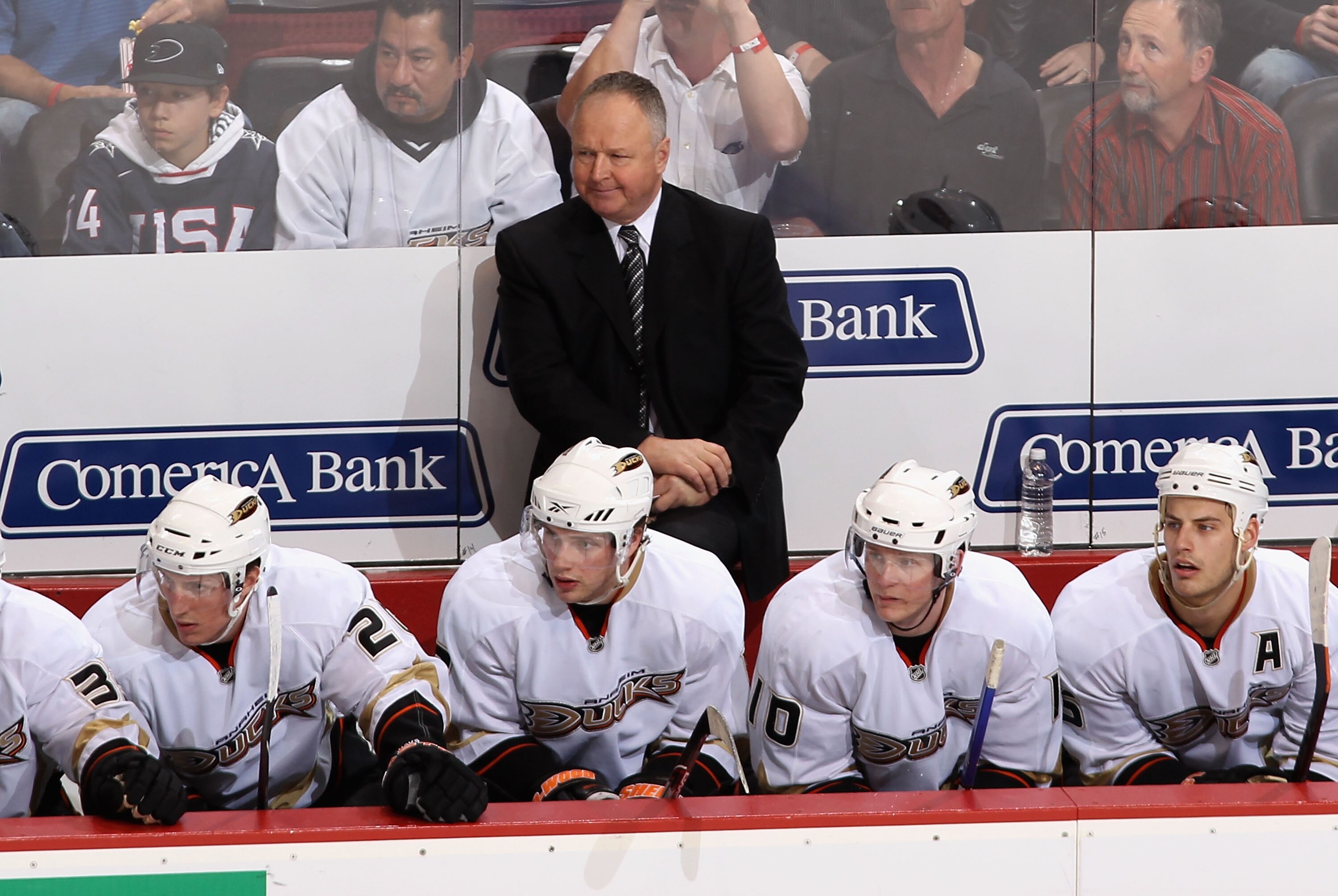 GLENDALE, AZ - MARCH 06:  Head coach Randy Carlyle of the Anaheim Ducks watches from the bench over (L-R) Ryan Carter #20, Bobby Ryan #9, Corey Perry #10 and Ryan Getzlaf #15 during the NHL game against the Phoenix Coyotes at Jobing.com Arena on March 6,