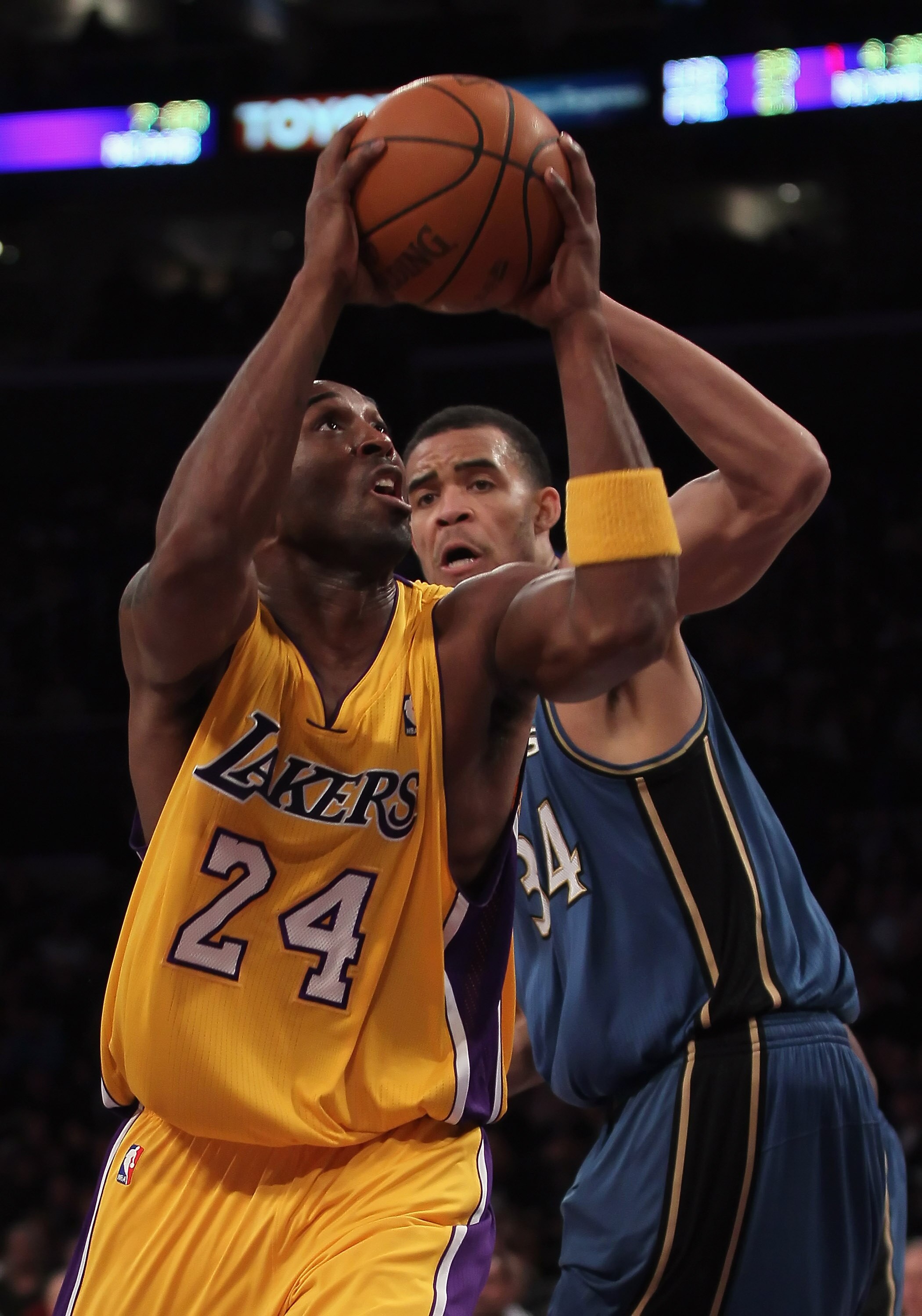 LOS ANGELES, CA - DECEMBER 07:  Kobe Bryant #24 of the Los Angeles Lakers drives to the basket past Javale McGee #34 of the Washington Wizards in the first half at Staples Center on December 7, 2010 in Los Angeles, California. NOTE TO USER: User expressly