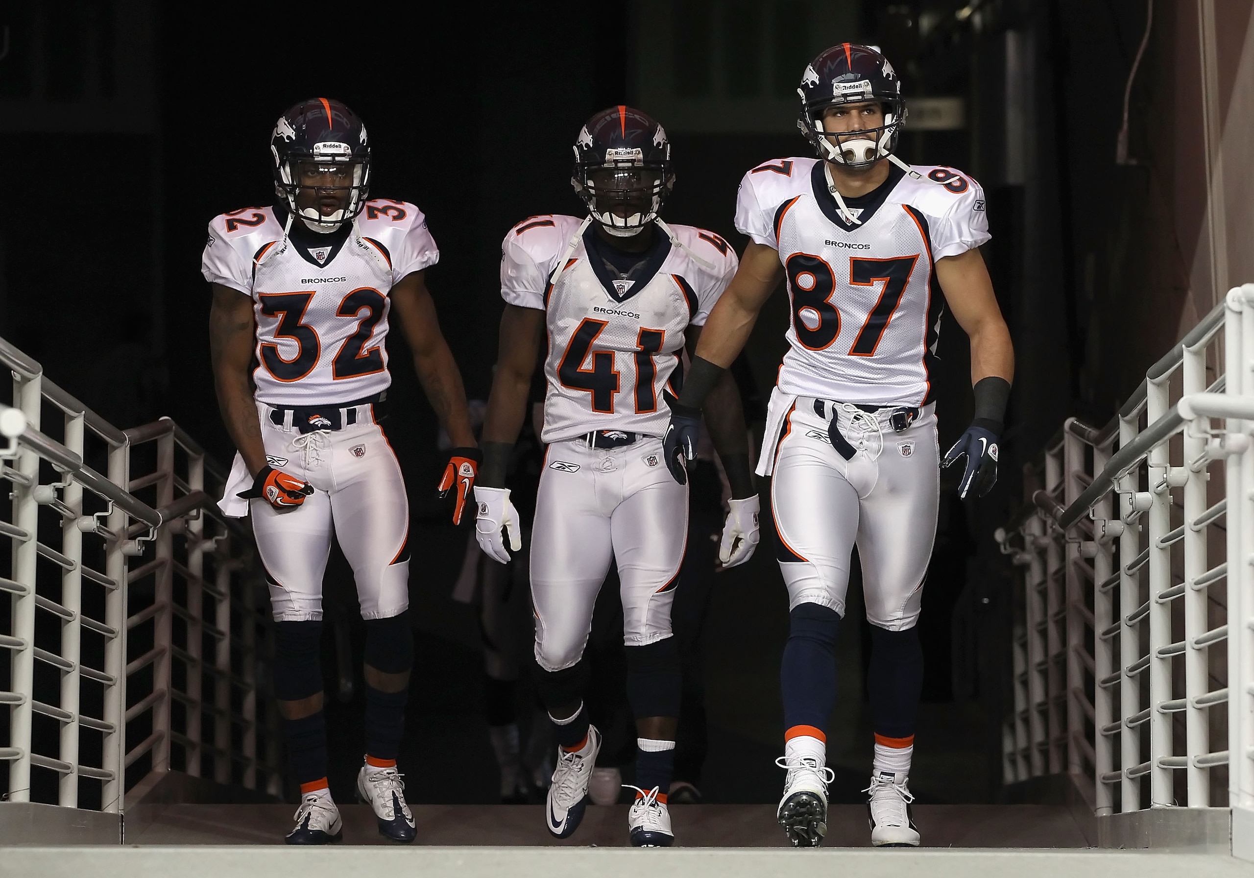 GLENDALE, AZ - DECEMBER 12: (L-R) Perrish Cox #32, Cassius Vaughn #41 and Eric Decker #87 of the Denver Broncos run out onto the field before the NFL game against the Arizona Cardinals at the University of Phoenix Stadium on December 12, 2010 in Glendale,