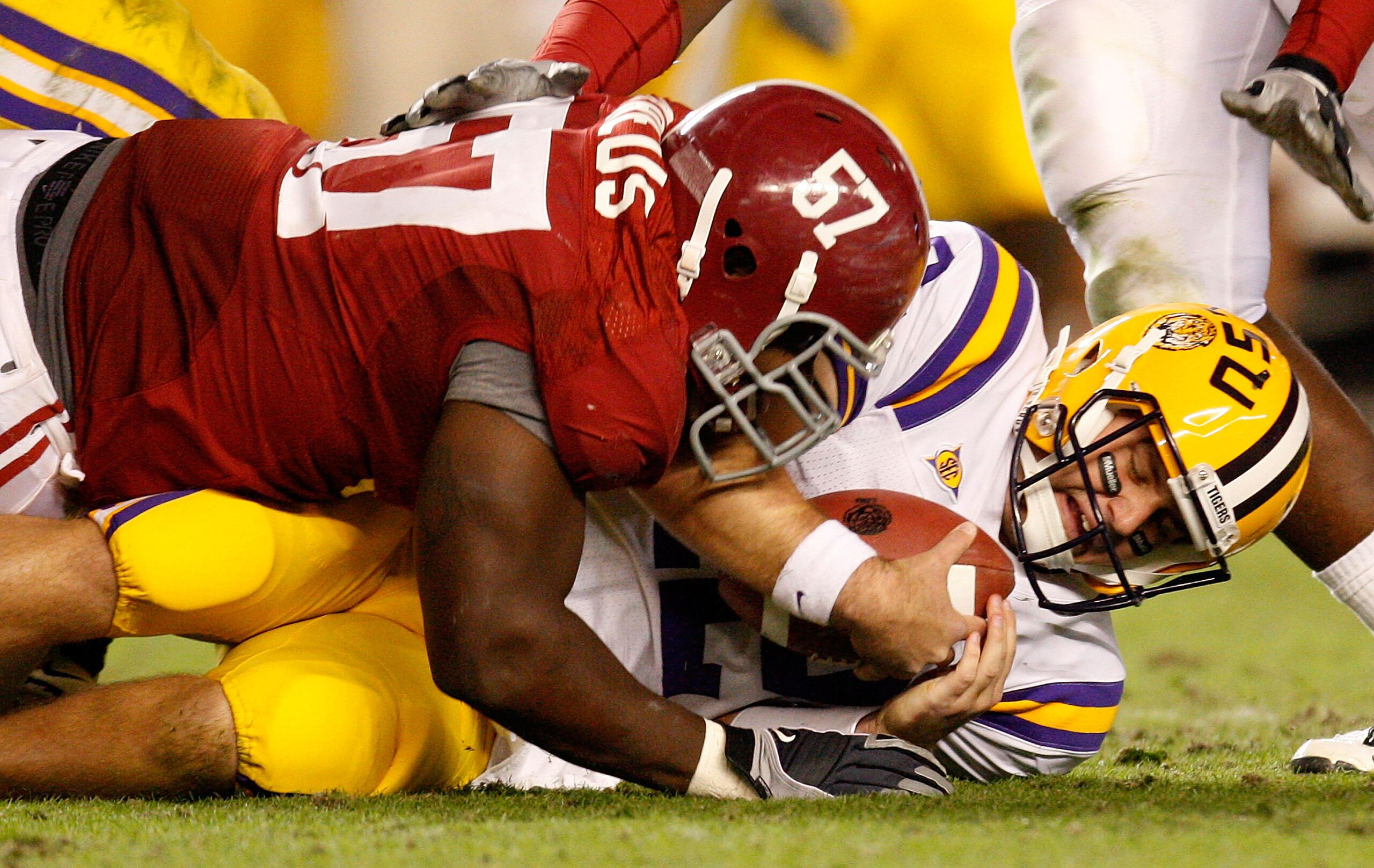 TUSCALOOSA, AL - NOVEMBER 07:  Marcell Dareus #57 of the Alabama Crimson Tide sacks quarterback Jarrett Lee #12 of the Louisiana State University Tigers at Bryant-Denny Stadium on November 7, 2009 in Tuscaloosa, Alabama.  (Photo by Kevin C. Cox/Getty Imag