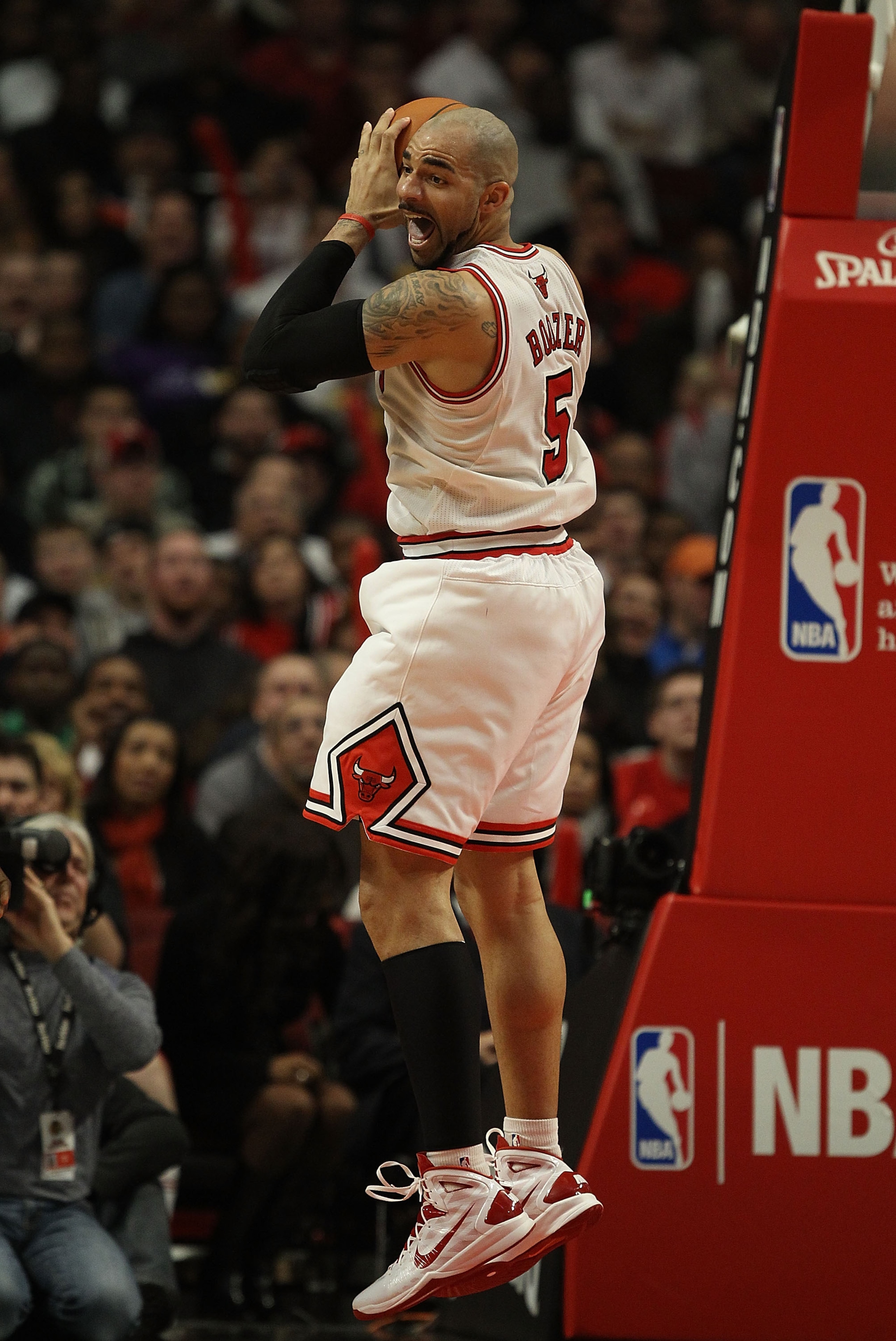 CHICAGO, IL - DECEMBER 10: Carlos Boozer #5 of the Chicago Bulls grabs a rebound against the Los Angeles Lakers at the United Center on December 10, 2010 in Chicago, Illinois. The Bulls defeated the Lakers 88-84. NOTE TO USER: User expressly acknowledges