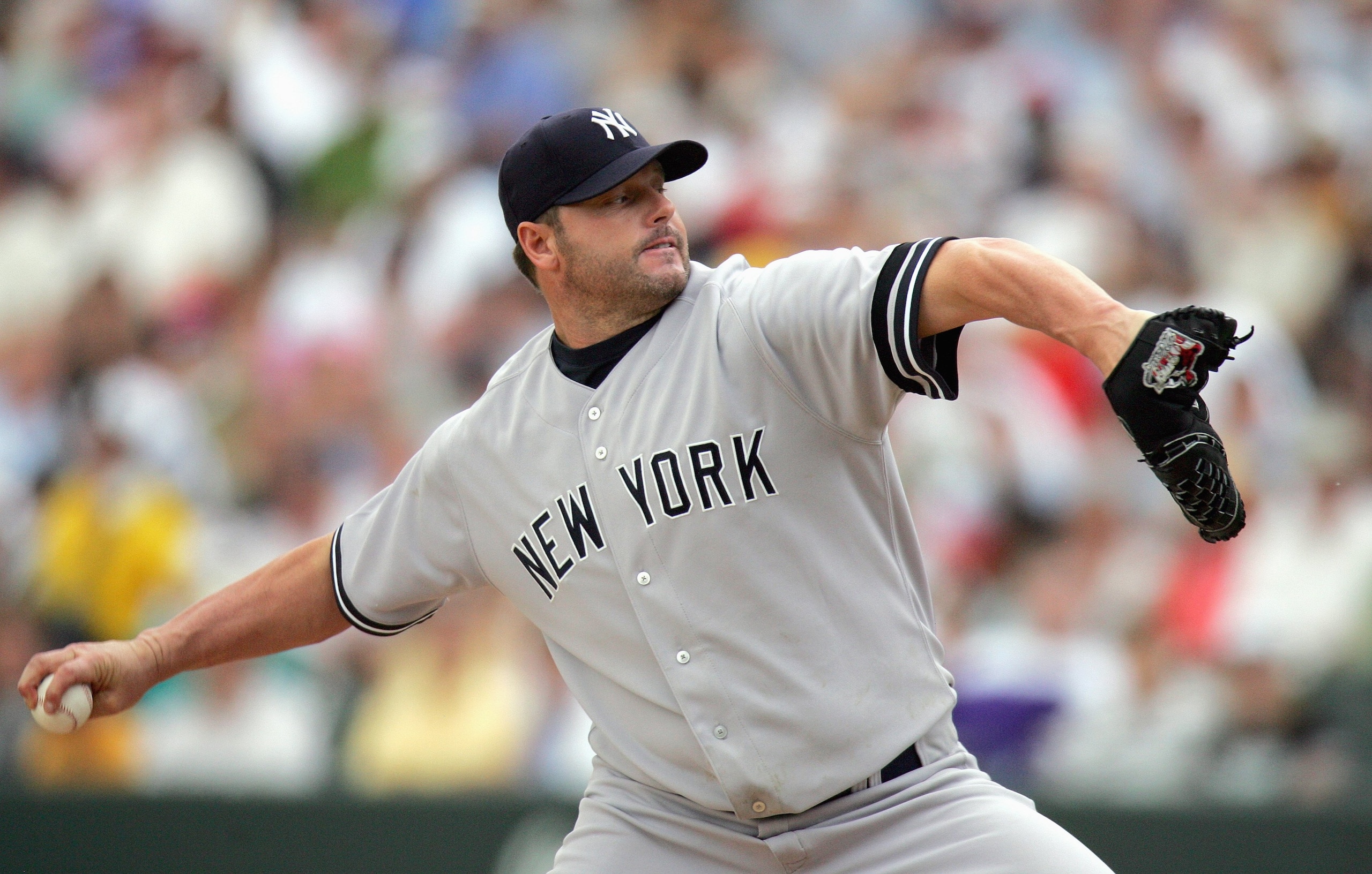 DENVER - JUNE 21: Roger Clemens #22of the New York Yankees delivers the pitch during the game against the Colorado Rockies at Coors Field on June 21, 2007 in Denver, Colorado. Rockies defeated the Yankees 4-3 during Interleague play.  (Photo by Doug Pensi