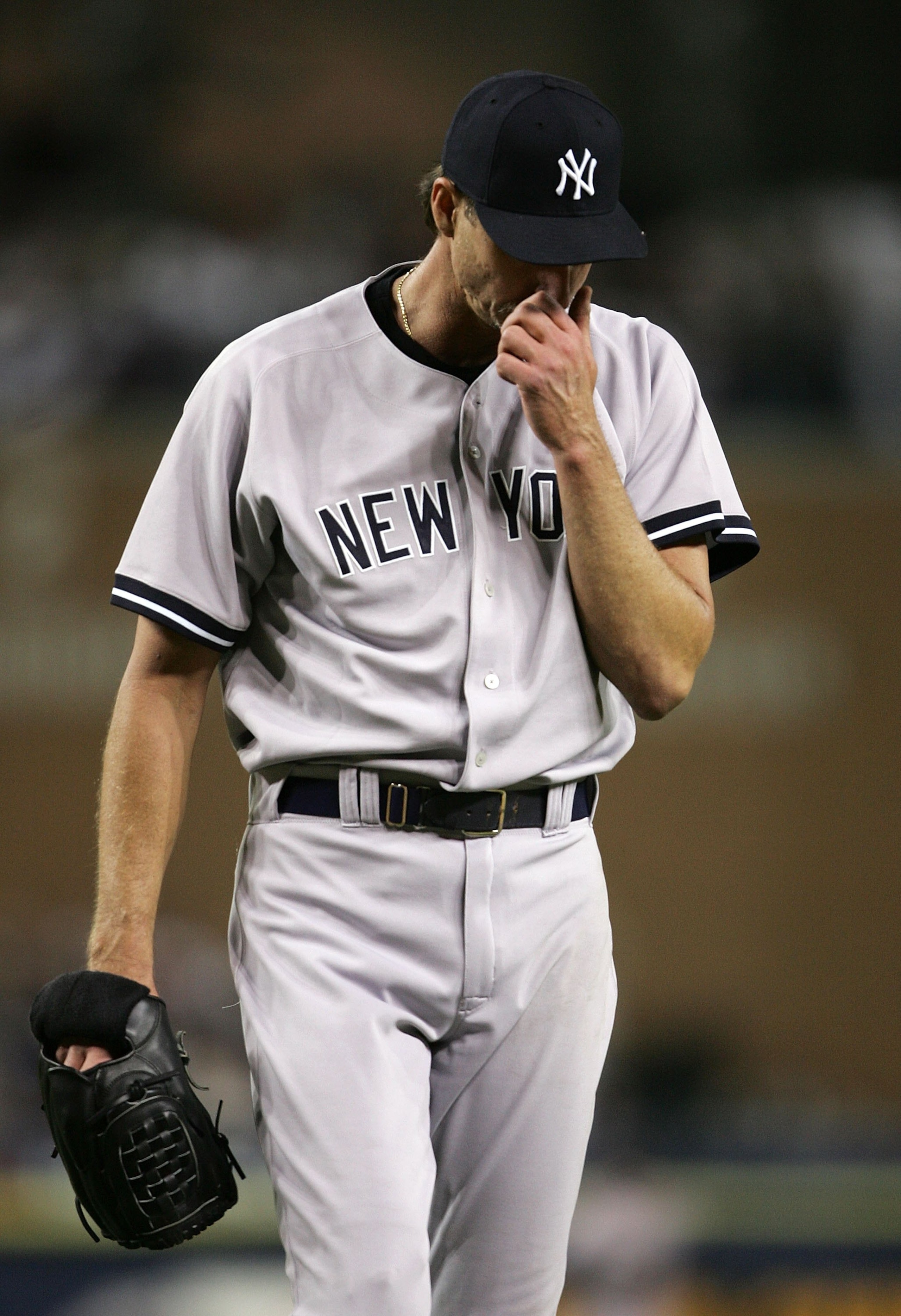 DETROIT - OCTOBER 06:  Starting pitcher Randy Johnson #41 of the New York Yankees wipes his face against the Detroit Tigers during Game Three of the 2006 American League Division Series on Octiber 6, 2006 at Comerica Park in Detroit, Michigan.  (Photo by