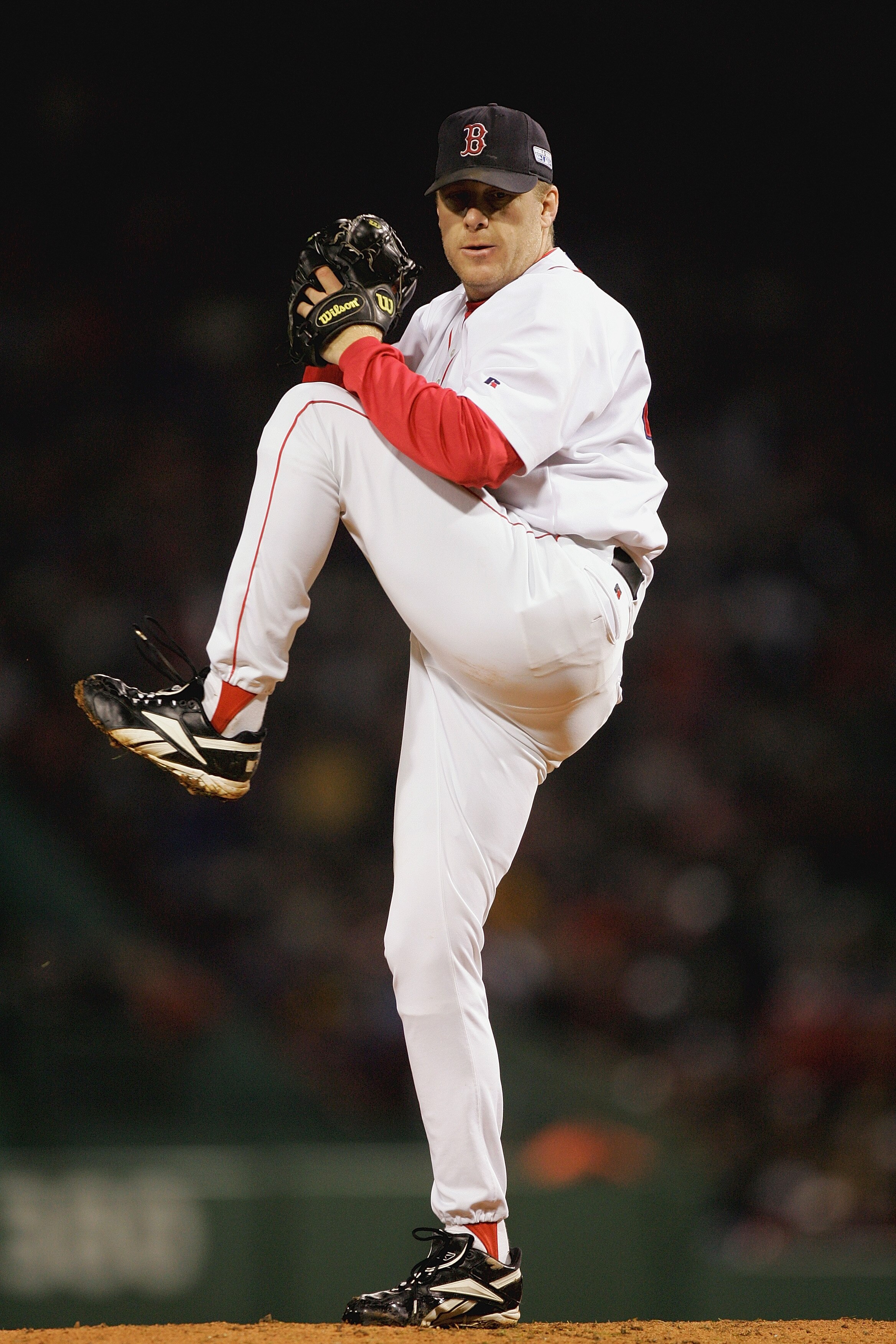 BOSTON - OCTOBER 24:  Curt Schilling #38 of the Boston Red Sox pitches against the St. Louis Cardinals during game two of the 2004 World Series on October 24, 2004 at Fenway Park in Boston, Massachusetts. (Photo by Ezra Shaw/Getty Images)