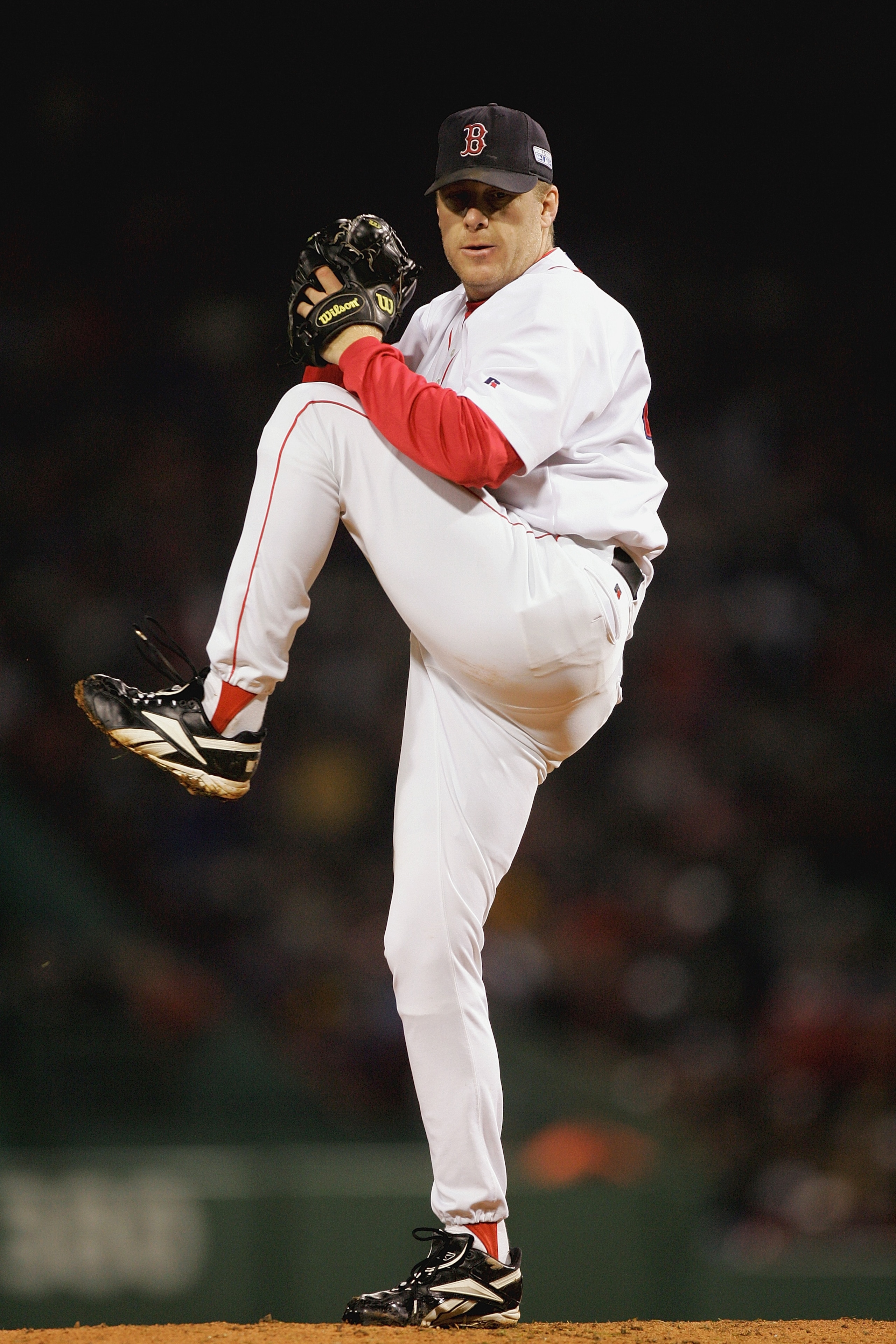 BOSTON - OCTOBER 24:  Curt Schilling #38 of the Boston Red Sox pitches against the St. Louis Cardinals during game two of the 2004 World Series on October 24, 2004 at Fenway Park in Boston, Massachusetts. (Photo by Ezra Shaw/Getty Images)