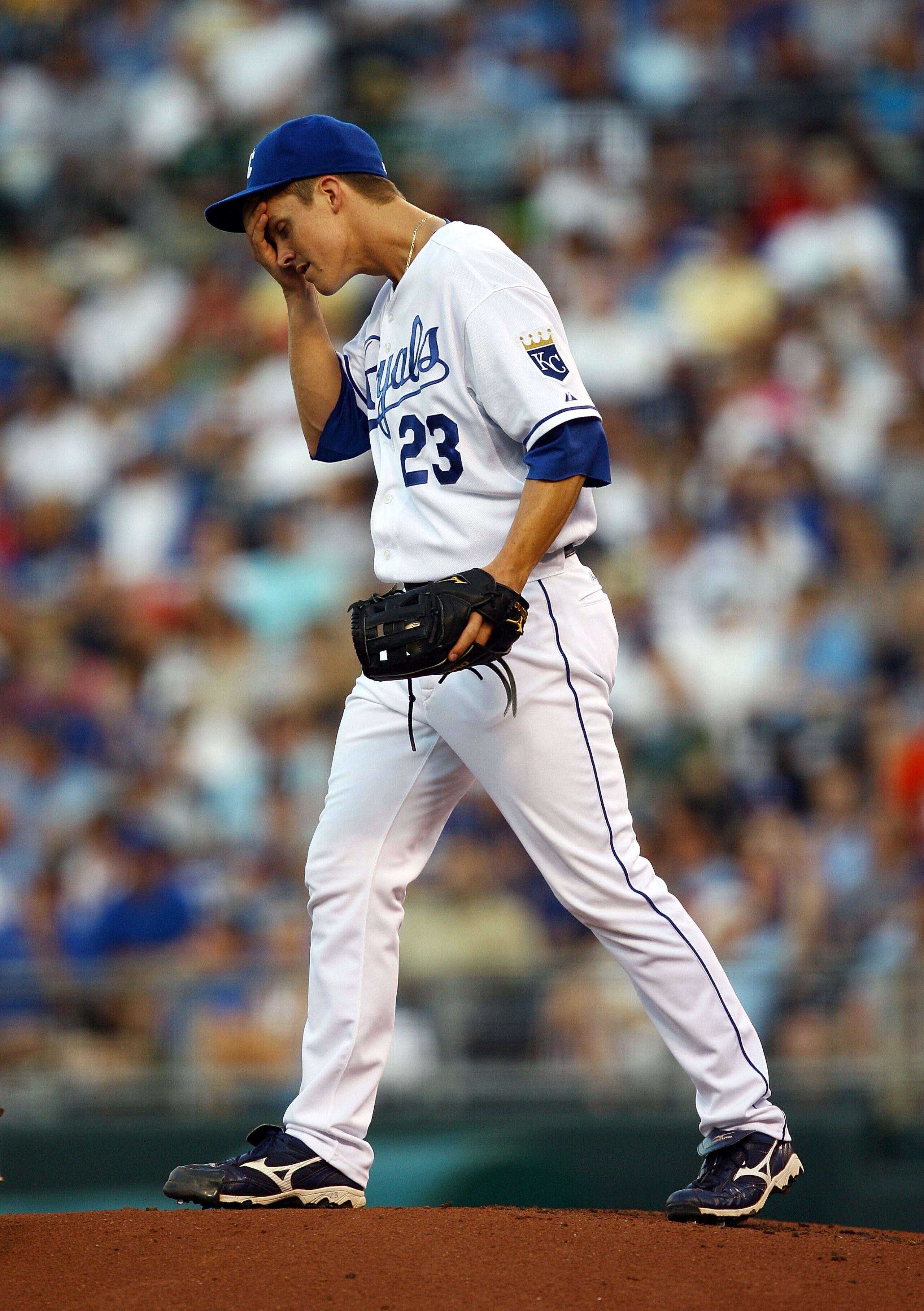 KANSAS CITY, MO - JUNE 17: Starting pitcher Zack Greinke #23 of the Kansas City Royals reacts after giving up three runs during the 4th inning of the game against the Arizona Diamondbacks on June 17, 2009 at Kauffman Stadium in Kansas City, Missouri. (P KANSAS CITY, MO - JUNE 17: Starting pitcher Zack Greinke #23 of the Kansas City Royals reacts after giving up three runs during the 4th inning of the game against the Arizona Diamondbacks on June 17, 2009 at Kauffman Stadium in Kansas City, Missouri. (P