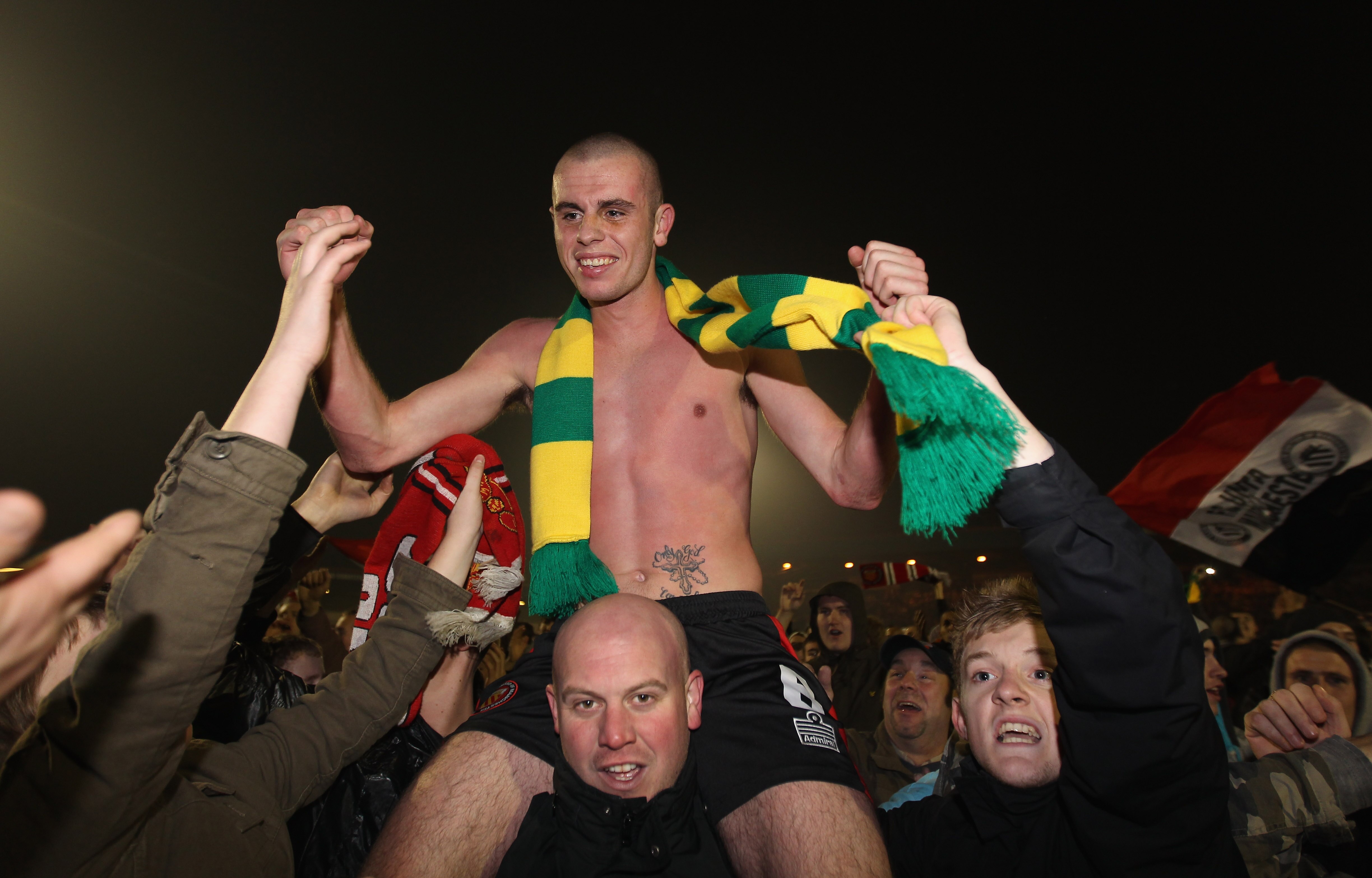 ROCHDALE, ENGLAND - NOVEMBER 05:  Scott McManus of FC United of Manchester is mobbed by supporters after victory over Rochdale in the FA Cup 1st Round match sponsored by e-on at Spotland Stadium on November 5, 2010 in Rochdale, England.  (Photo by Alex Li