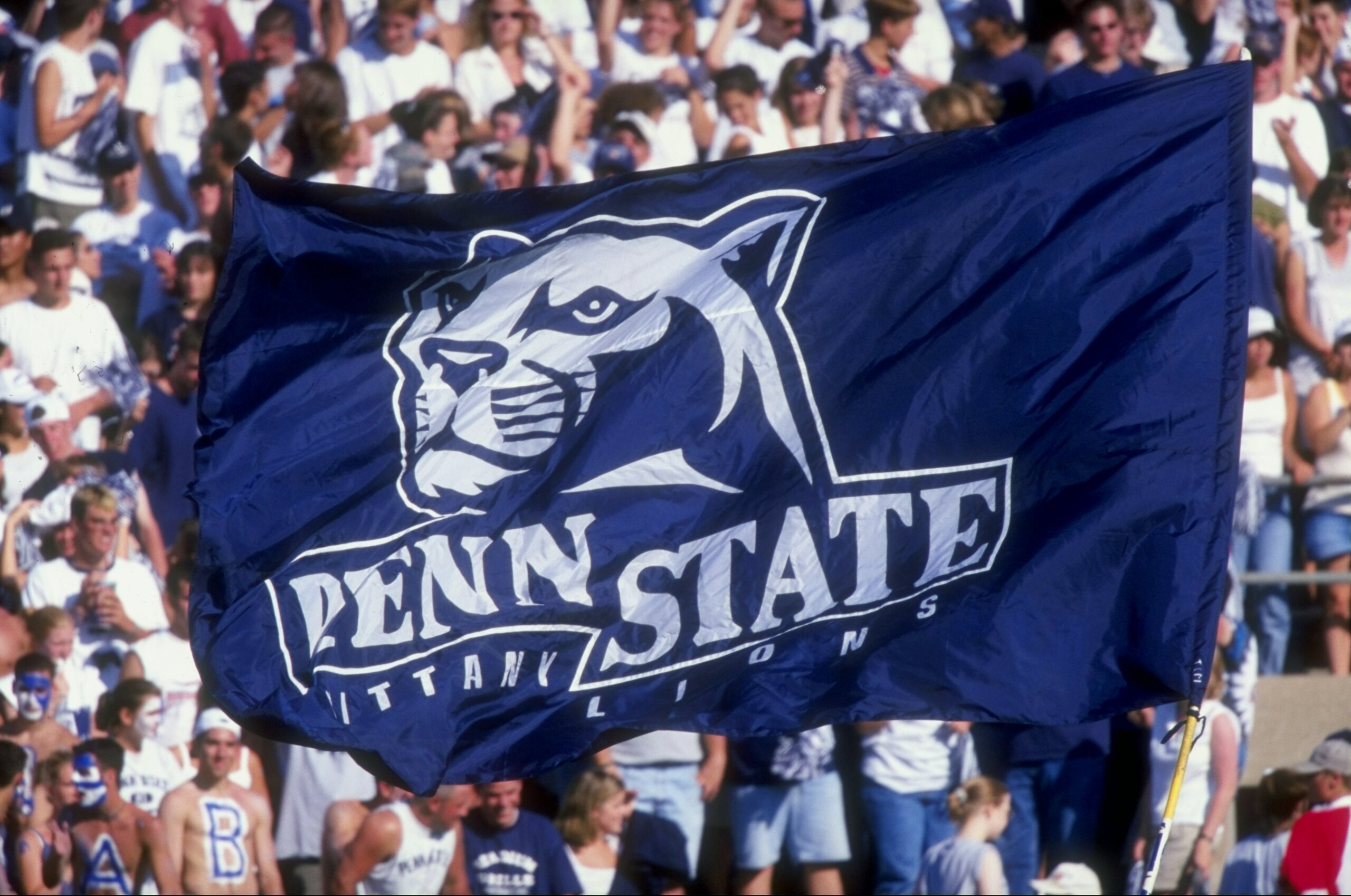 5 Sep 1998:  Penn State Nittany Lion fans hoist a flag up in the air during a game against the Southern Mississippi State Golden Eagles at the Beaver Stadium in State College, Pennsylvania. The Nittany Lions defeated the Golden Eagles 34-6. Mandatory Cred