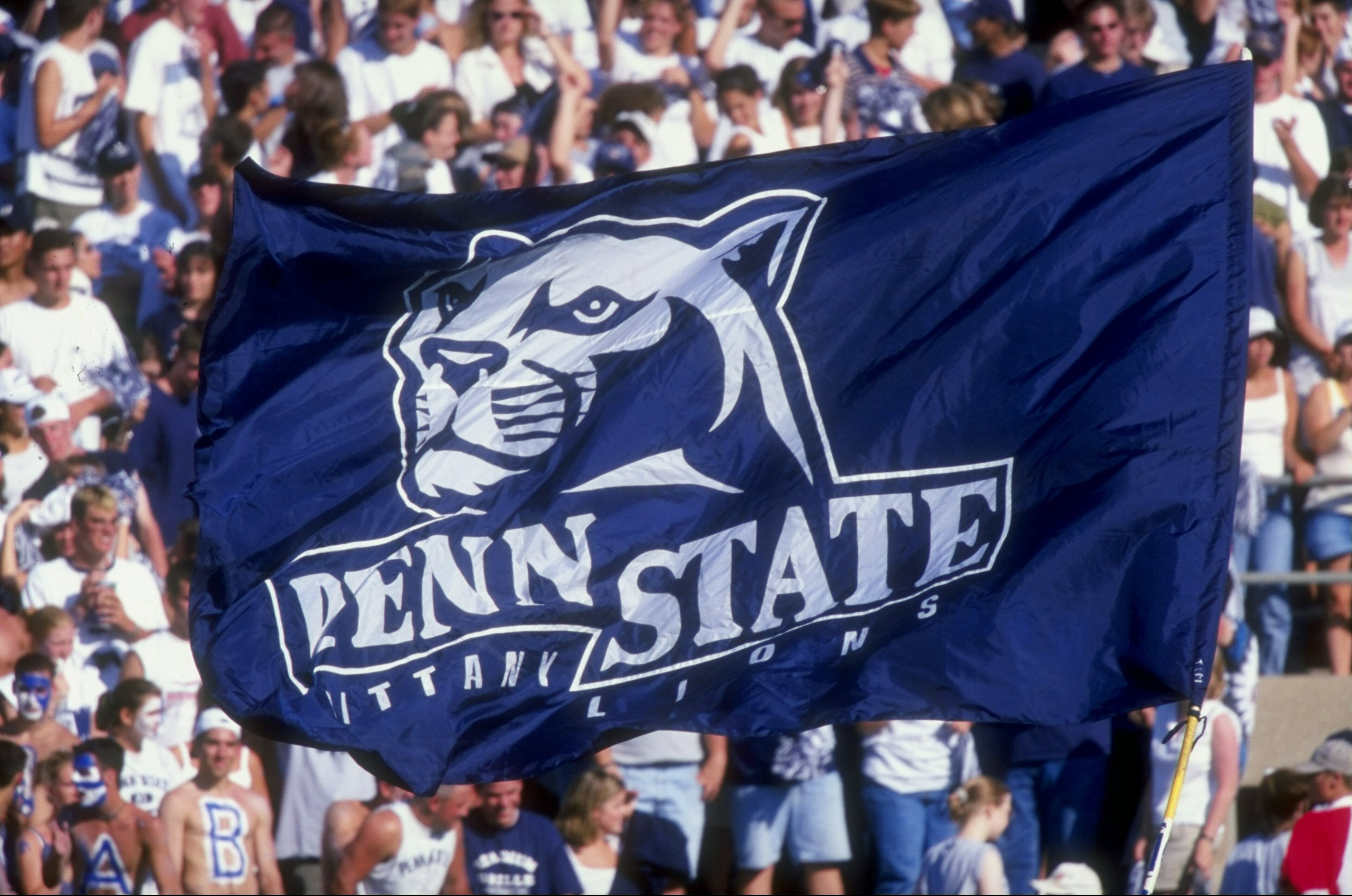 5 Sep 1998:  Penn State Nittany Lion fans hoist a flag up in the air during a game against the Southern Mississippi State Golden Eagles at the Beaver Stadium in State College, Pennsylvania. The Nittany Lions defeated the Golden Eagles 34-6. Mandatory Cred