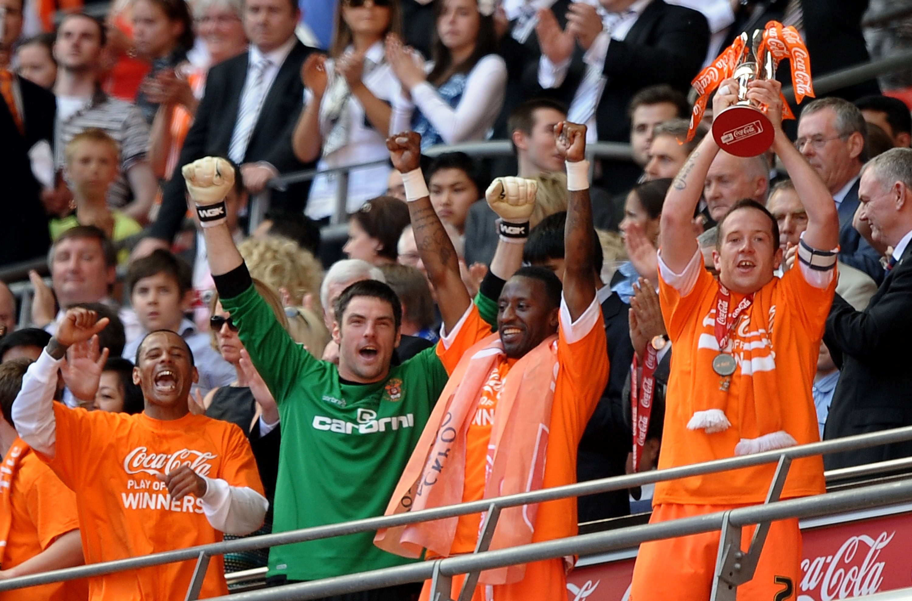 LONDON, ENGLAND - MAY 22:  Charlie Adam and the Blackpool team celebrate promotion during the Coca-Cola Championship Playoff Final between Blackpool and Cardiff City at Wembley Stadium on May 22, 2010 in London, England.  (Photo by Laurence Griffiths/Gett