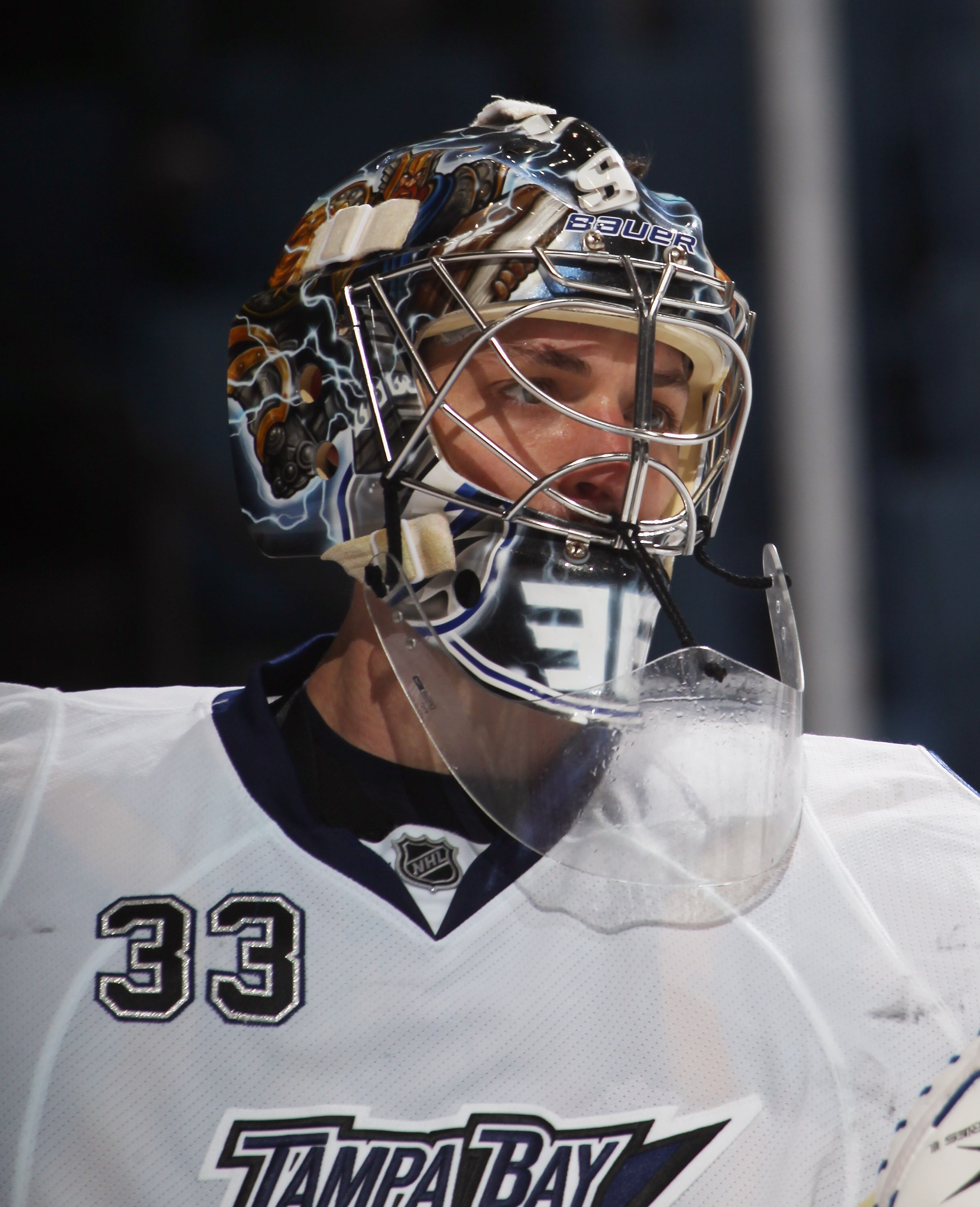 UNIONDALE, NY - NOVEMBER 17:  Dan Ellis #33 of the Tampa Bay Lightning tends net against the New York Islanders at the Nassau Coliseum on November 17, 2010 in Uniondale, New York.  (Photo by Bruce Bennett/Getty Images)