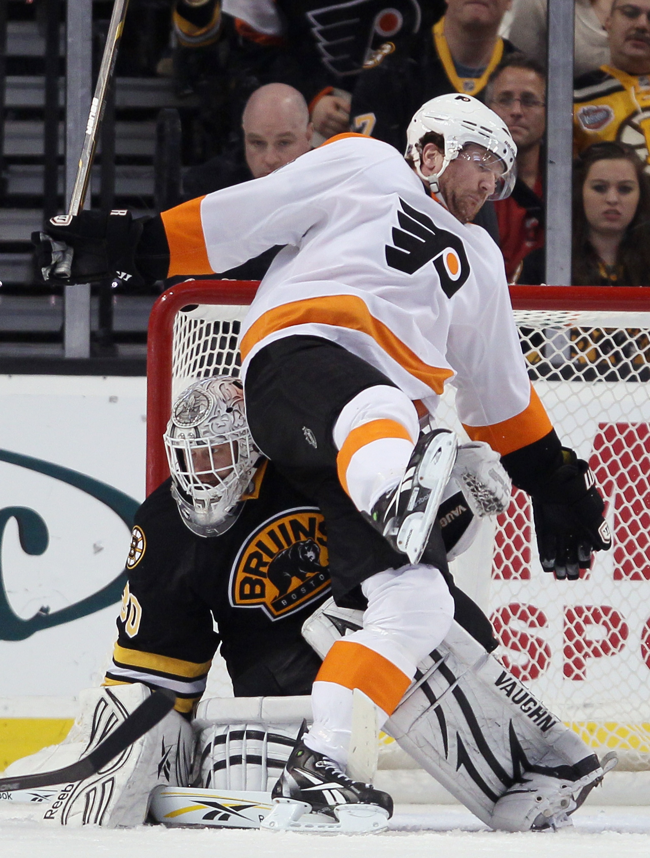 BOSTON, MA - DECEMBER 11:  Scott Hartnell #19 of the Philadelphia Flyers falls over Tim Thomas #30 of the Boston Bruins on December 11, 2010 at the TD Garden in Boston, Massachusetts. The Flyers defeated the Bruins 2-1 in overtime.  (Photo by Elsa/Getty I