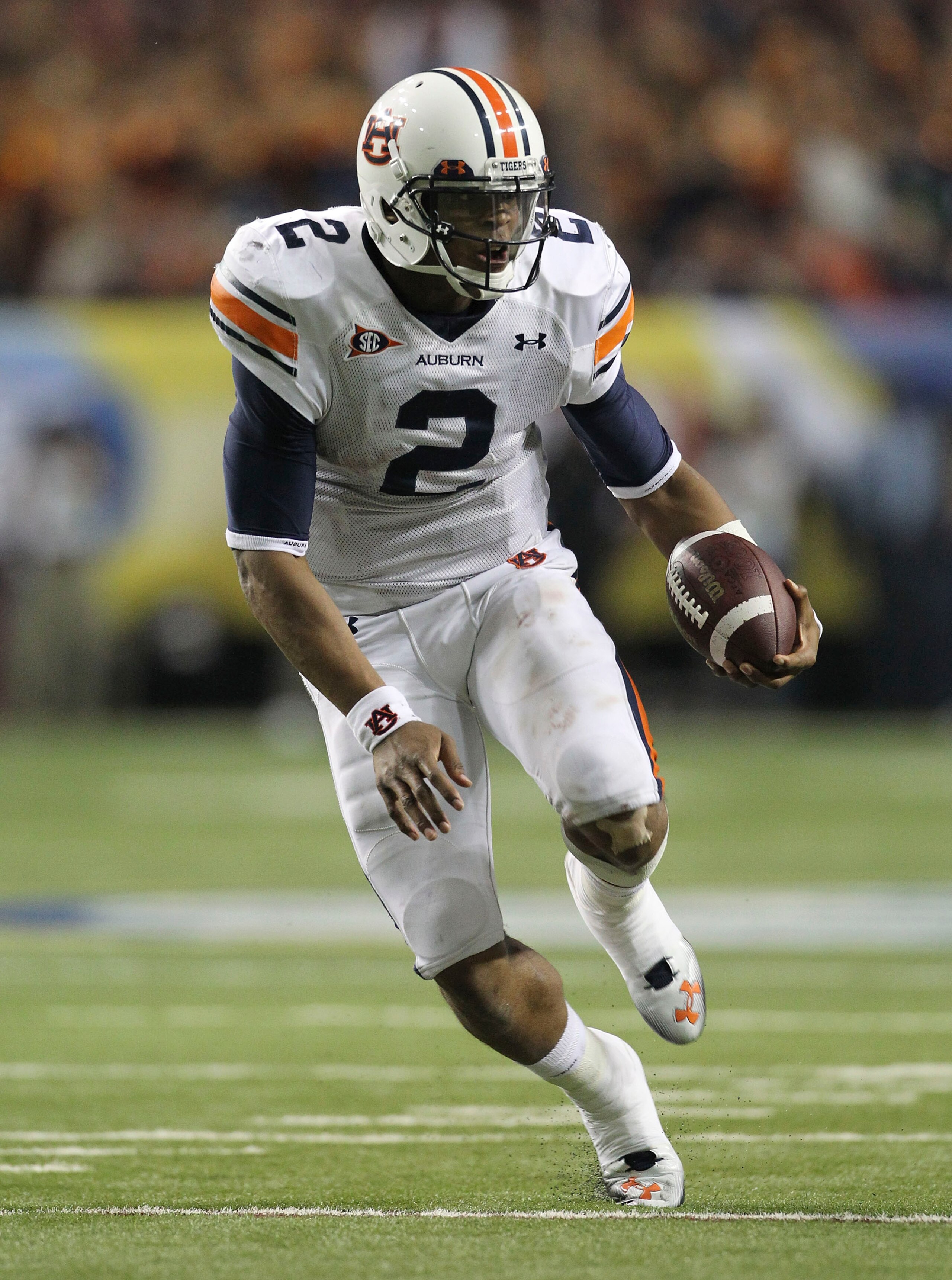 ATLANTA - DECEMBER 04:  Quarterback Cam Newton #2 of the Auburn Tigers runs with the ball during the 2010 SEC Championship against the South Carolina Gamecocks at Georgia Dome on December 4, 2010 in Atlanta, Georgia.  (Photo by Mike Zarrilli/Getty Images)