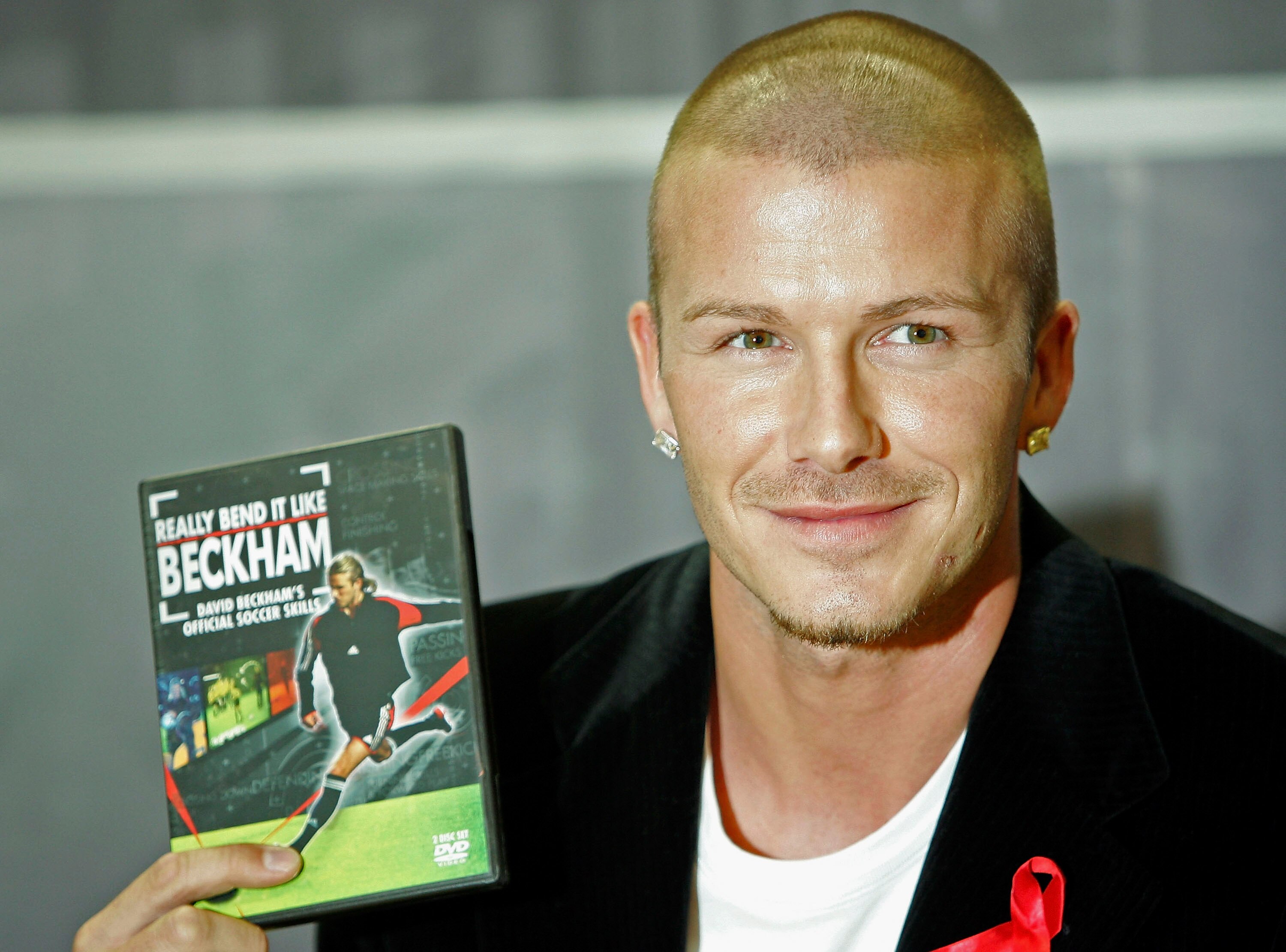 LONDON - DECEMBER 1:  Real Madrid and England footballer David Beckham promotes 'Really Bend It Like Beckham', his first official training skills DVD, at the Virgin Megastore, Oxford Street on December 1, 2004 in London. (Photo by MJ Kim/Getty Images)