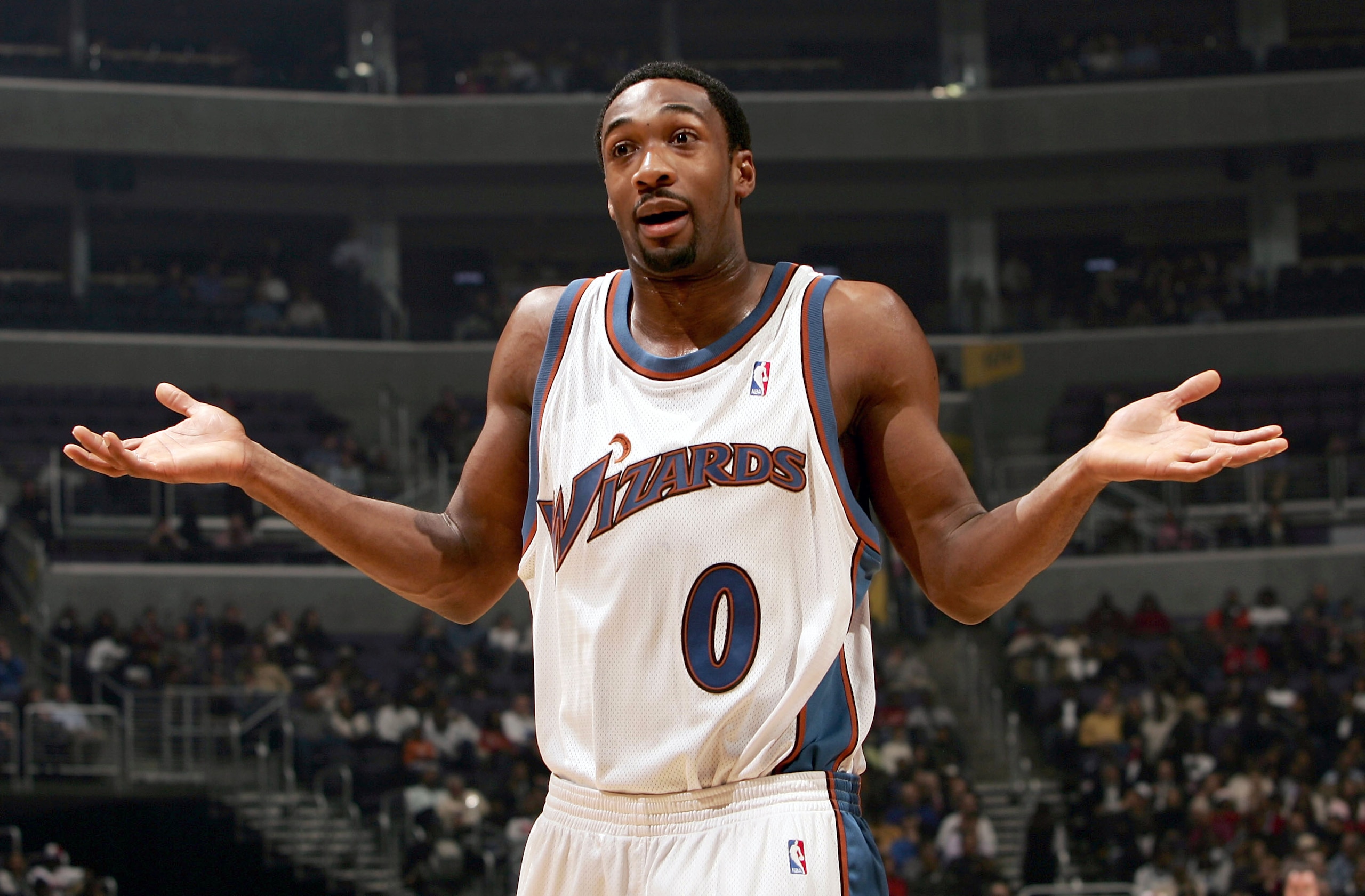 WAHINGTON\ - DECEMBER 15:  Gilbert Arenas #0 of the Washington Wizards questions a call with the ref as they host the Miami Heat during NBA action on December 15, 2004 at the MCI Center in Washington, DC.  NOTE TO USER:  User expressly acknowledges and ag