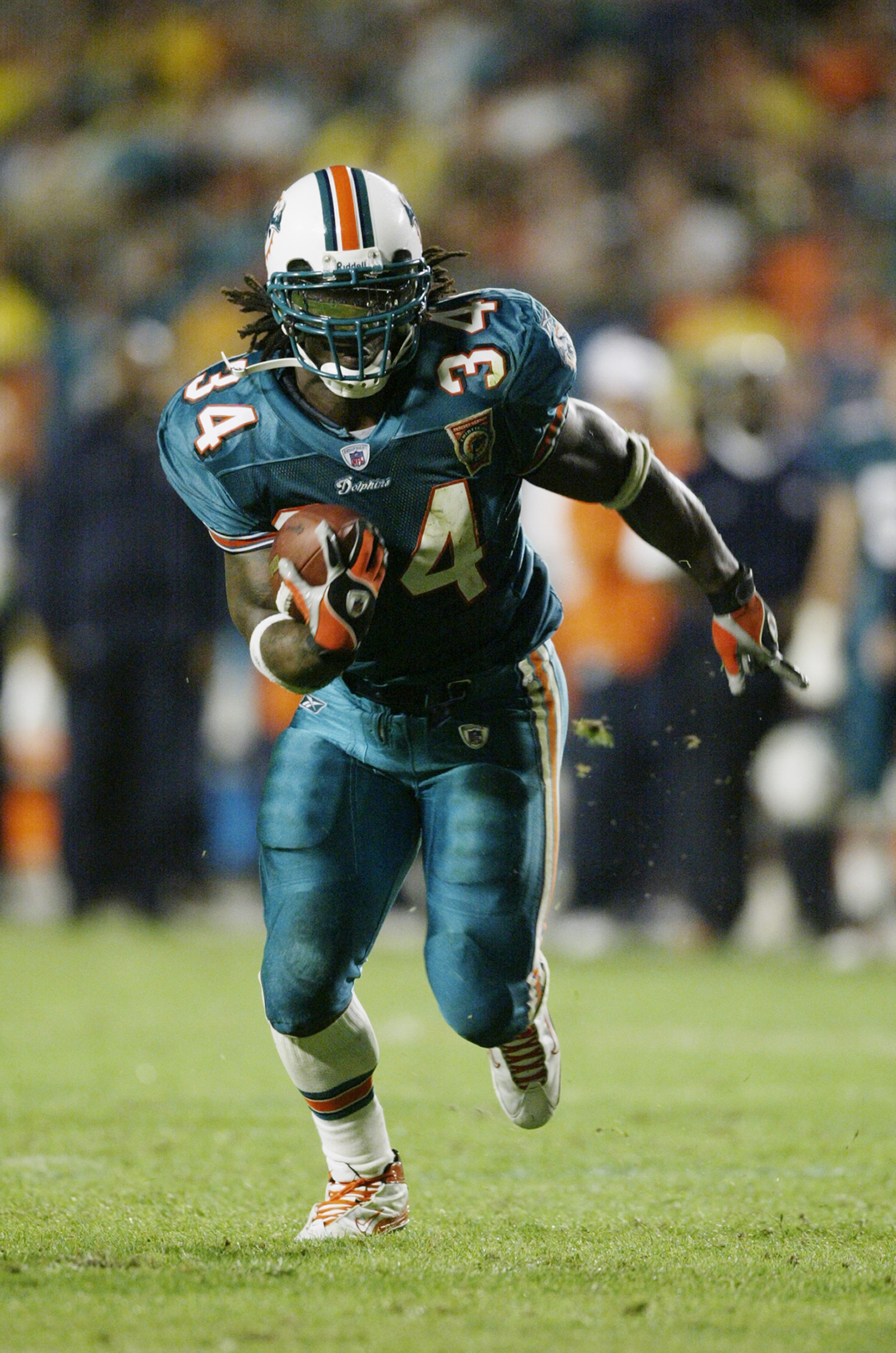 MIAMI, FL - DECEMBER 9: Running back Ricky Williams #34 of the Miami Dolphins runs against the Chicago Bears during the game at Pro Player Stadium on December 9, 2002 in Miami, Florida. The Dolphins defeated the Bears 27-9. (Photo by Jed Jacobsohn/Getty MIAMI, FL - DECEMBER 9: Running back Ricky Williams #34 of the Miami Dolphins runs against the Chicago Bears during the game at Pro Player Stadium on December 9, 2002 in Miami, Florida. The Dolphins defeated the Bears 27-9. (Photo by Jed Jacobsohn/Getty
