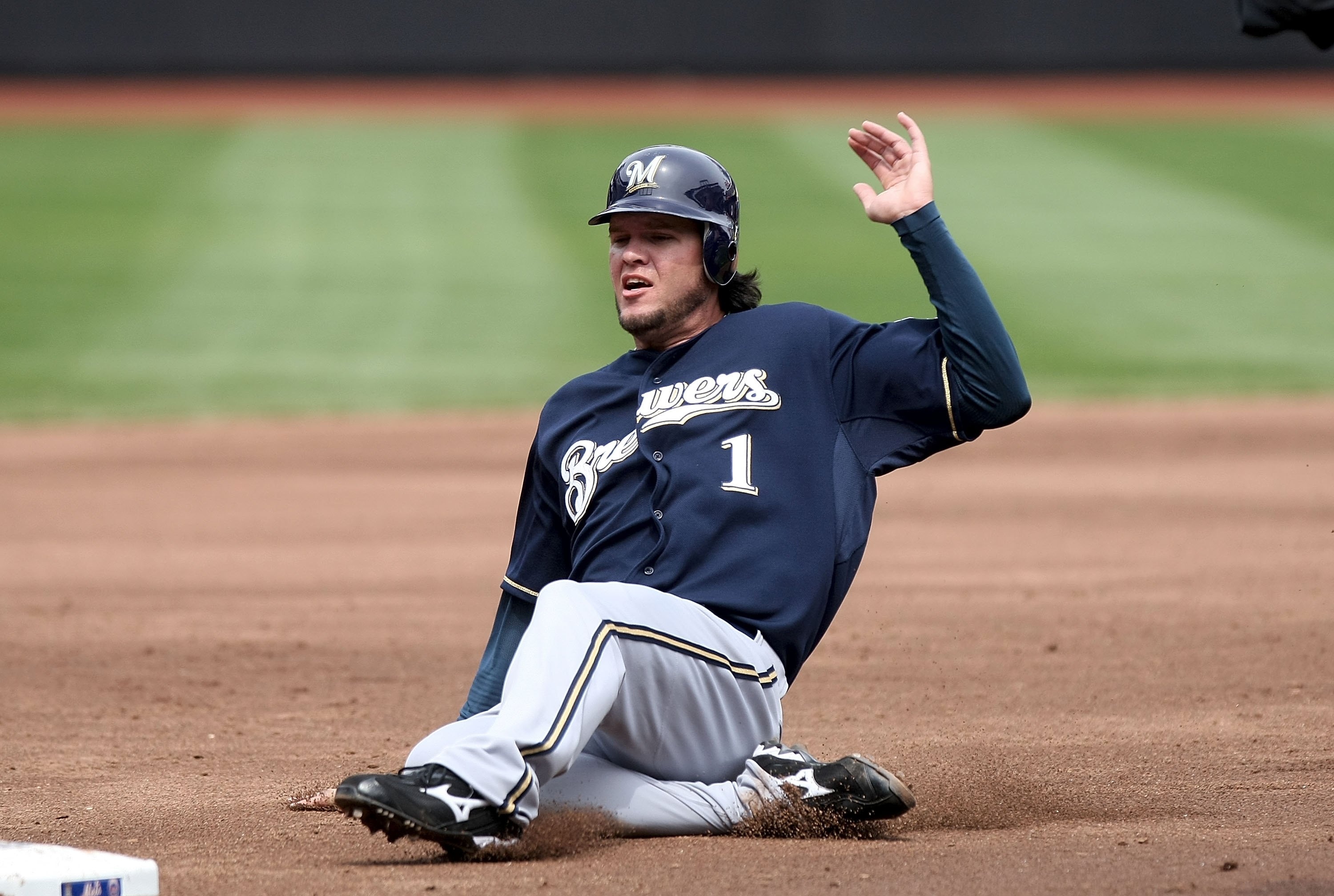 NEW YORK - APRIL 19: Corey Hart #1 of the Milwaukee Brewers slides into third against the New York Mets at Citi Field on April 19, 2009 in the Flushing neighborhood of the Queens borough of New York City.  (Photo by Nick Laham/Getty Images)