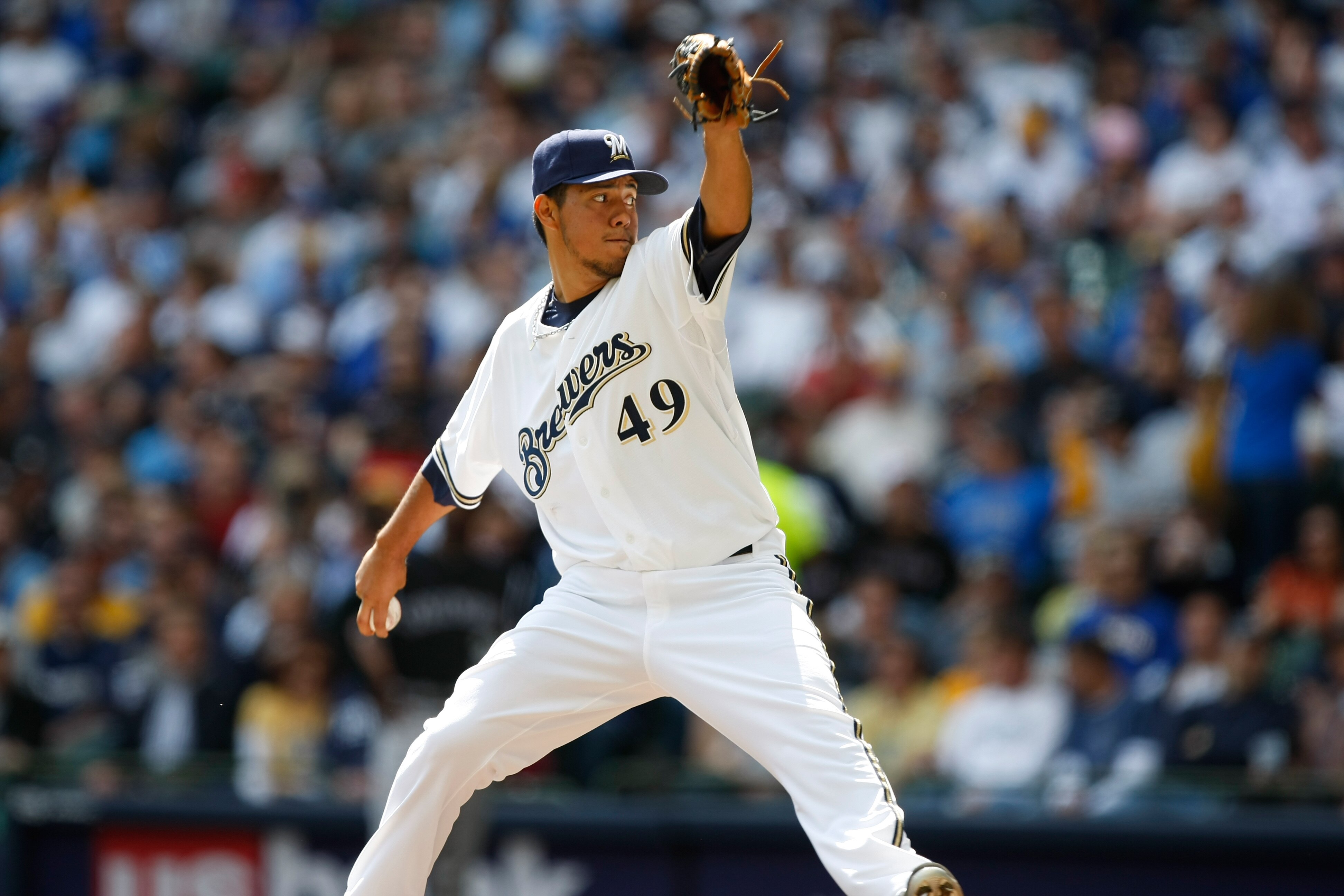 MILWAUKEE, WI - APRIL 05: Pitcher Yovani Gallardo #49 of the Milwaukee Brewers pitches the baseball against the Colorado Rockies at the Miller Park on April 05, 2010 in Milwaukee, Wisconsin. The Rockies defeated the Brewers 5-3.(Photo by Scott Boehm/Getty