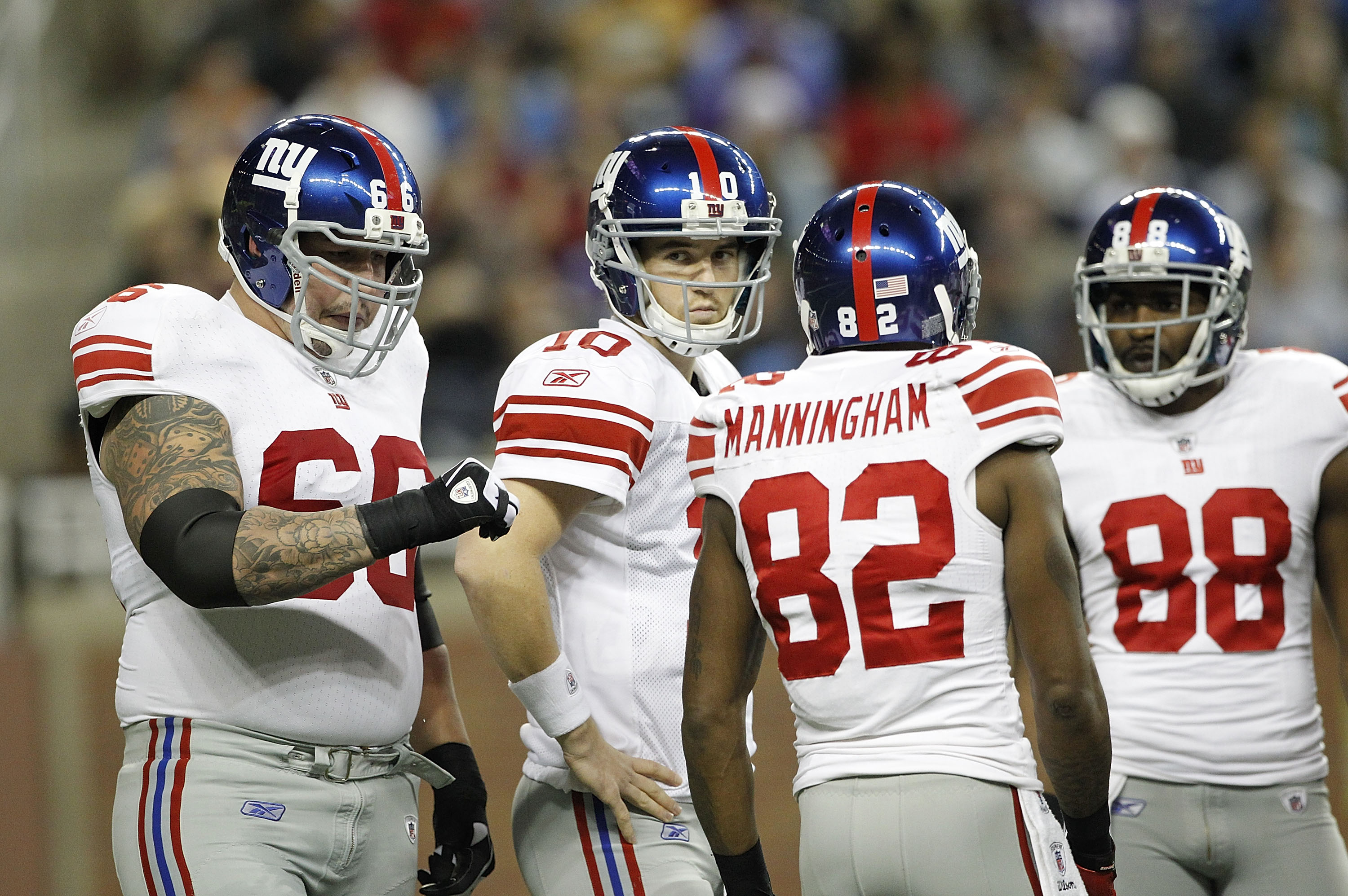 DETROIT, MI - DECEMBER 13: Eli Manning #10 of the New York Giants with teammates Dave Diehl #66 Mario Manningham #82 and Hakeem Nicks #88 during the game against the Minnesota Vikings at Ford Field on December 13, 2010 in Detroit, Michigan.  (Photo by Leo