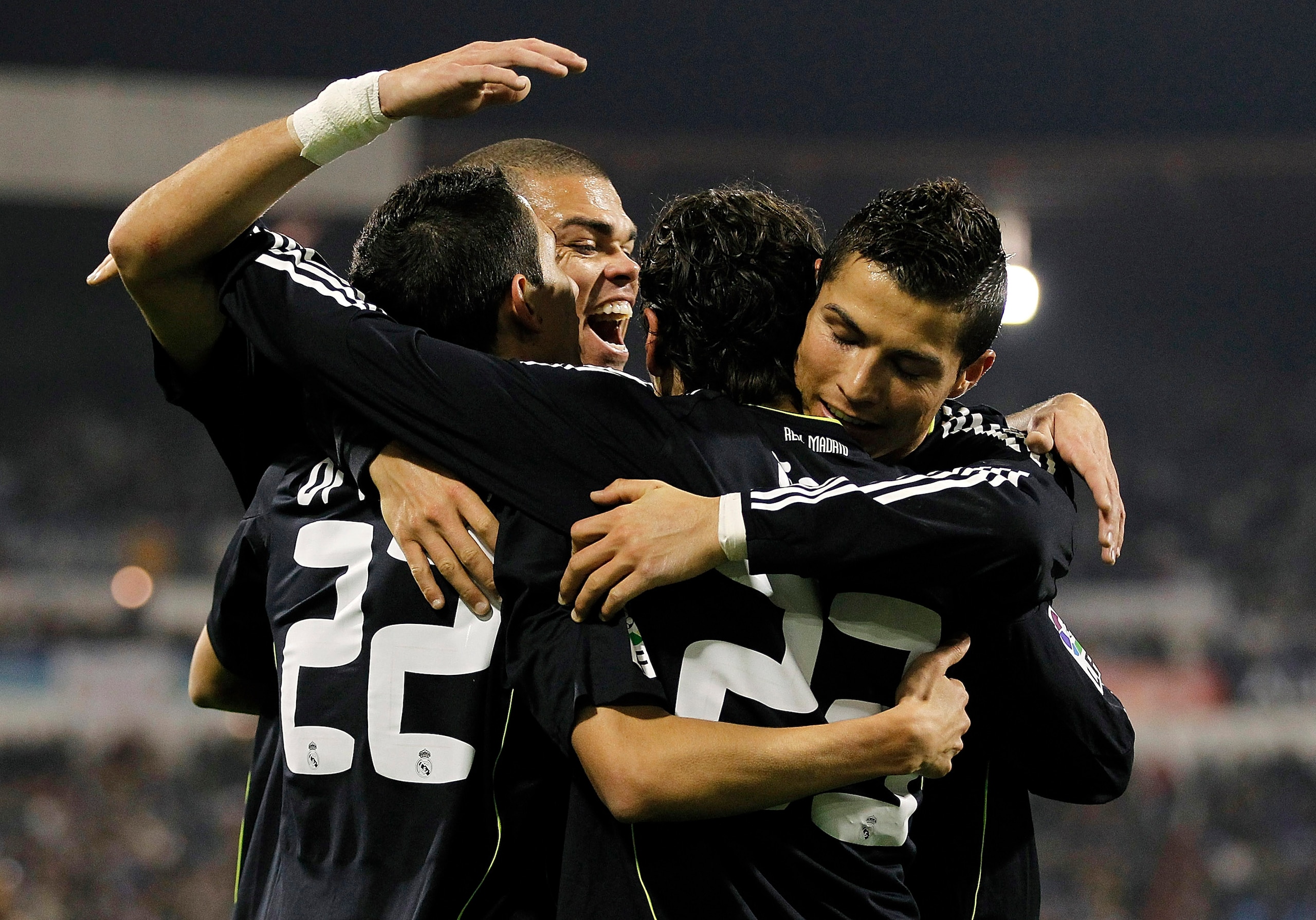 ZARAGOZA, SPAIN - DECEMBER 12: Mezut Ozil of Real Madrid celebrates with his team mates Cristiano Ronaldo (R), Pepe (C) and Angel di Maria after scoring Real's opening goal during the La Liga match between Real Zaragoza and Real Madrid at La Romareda sta ZARAGOZA, SPAIN - DECEMBER 12: Mezut Ozil of Real Madrid celebrates with his team mates Cristiano Ronaldo (R), Pepe (C) and Angel di Maria after scoring Real's opening goal during the La Liga match between Real Zaragoza and Real Madrid at La Romareda sta