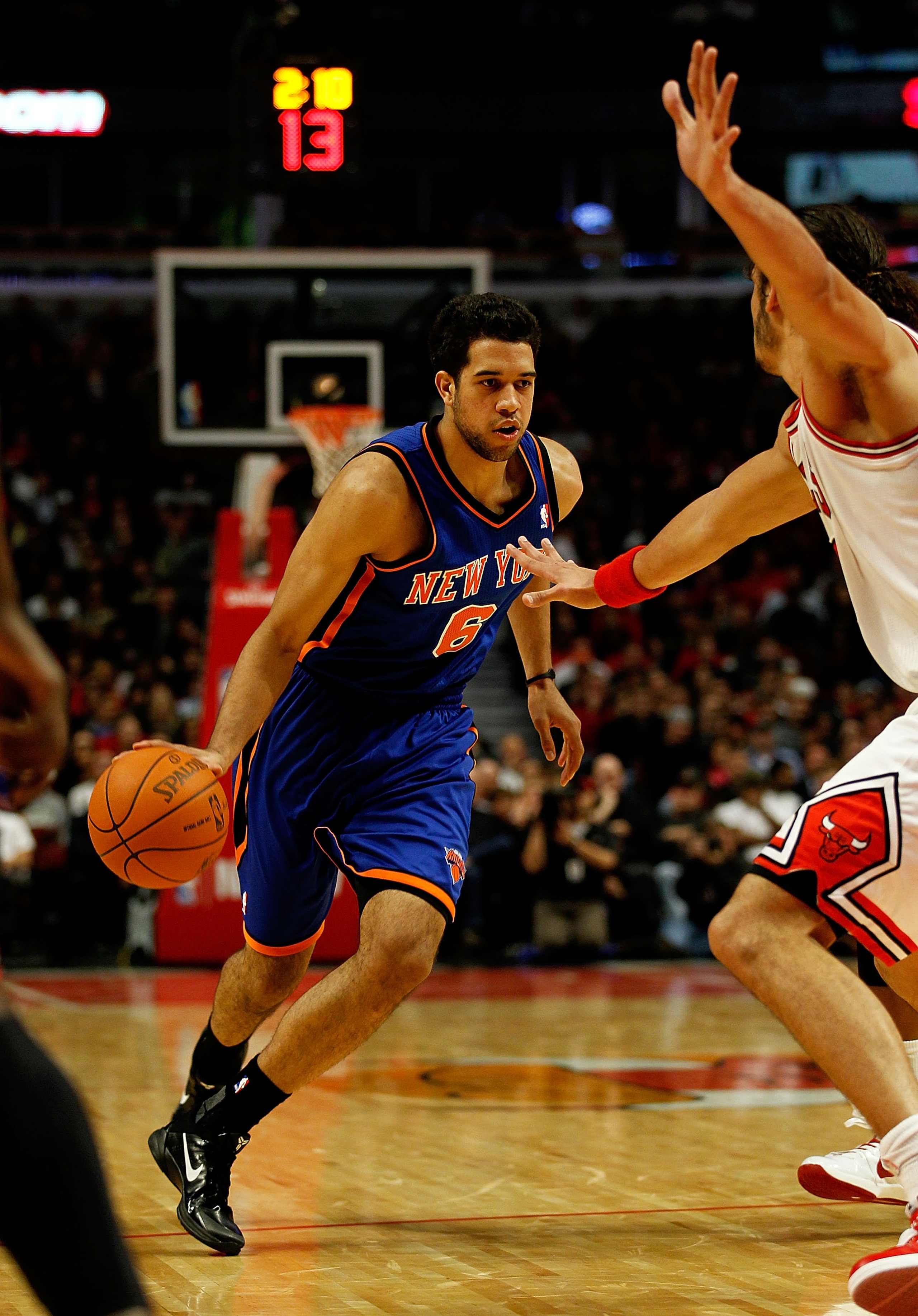 CHICAGO - NOVEMBER 04: Landry Fields #6 of the New York Knicks drives against Joakim Noah #13 of the Chicago Bulls at the United Center on November 4, 2010 in Chicago, Illinois. The Knicks defeated the Bulls 120-112. NOTE TO USER: User expressly acknowled