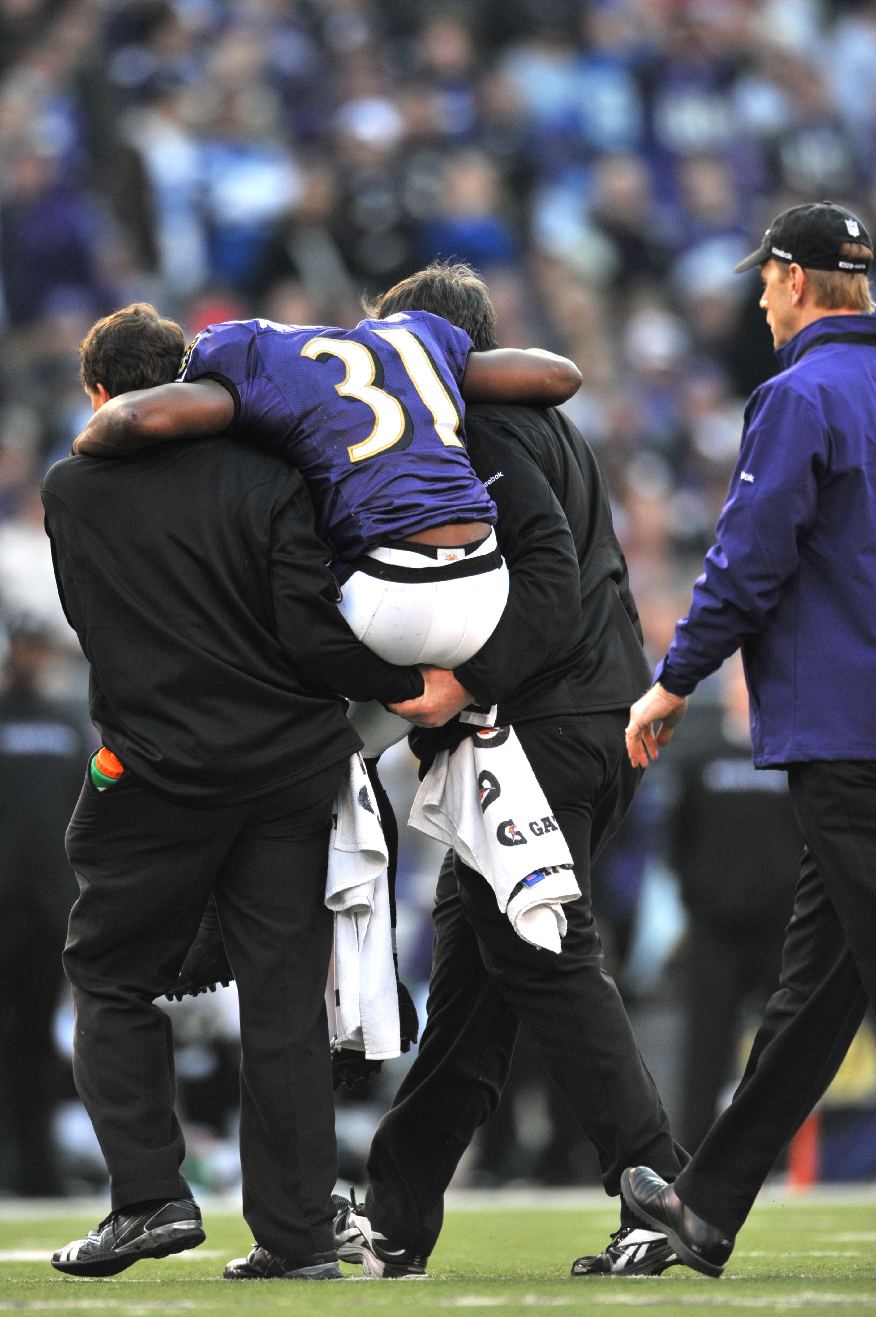 BALTIMORE - NOVEMBER 22:  Fabian Washington #31 of the Baltimore Ravens is carried off the field late in the game after an injury during the game against the Indianapolis Colts at M&T Bank Stadium on November 22, 2009 in Baltimore, Maryland. The Colts def