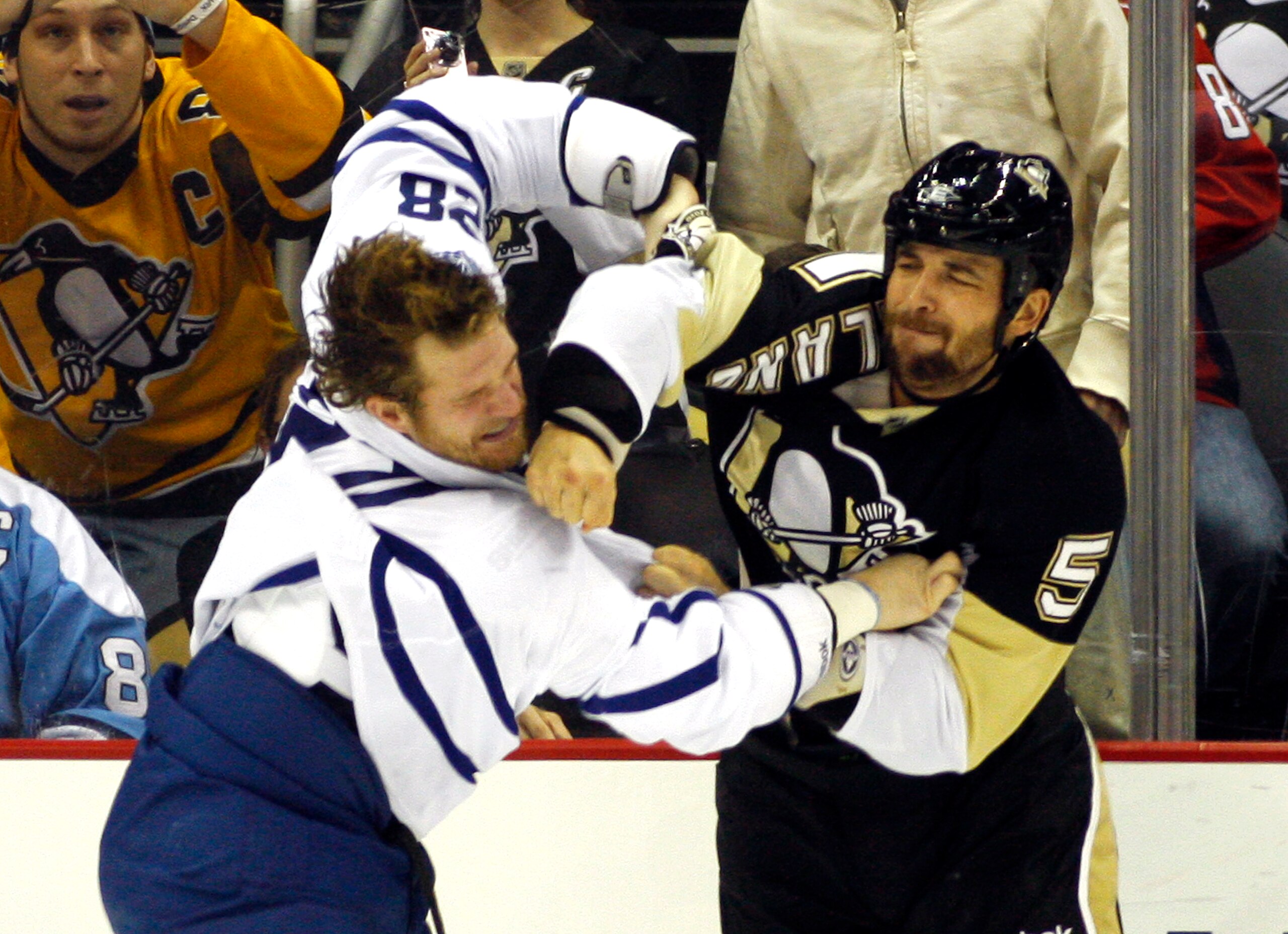 PITTSBURGH, PA - DECEMBER 08:  Deryk Engelland #5 of the Pittsburgh Penguins mixes it up against Colton Orr #28 of the Toronto Maple Leafs at Consol Energy Center on December 8, 2010 in Pittsburgh, Pennsylvania.  (Photo by Justin K. Aller/Getty Images)