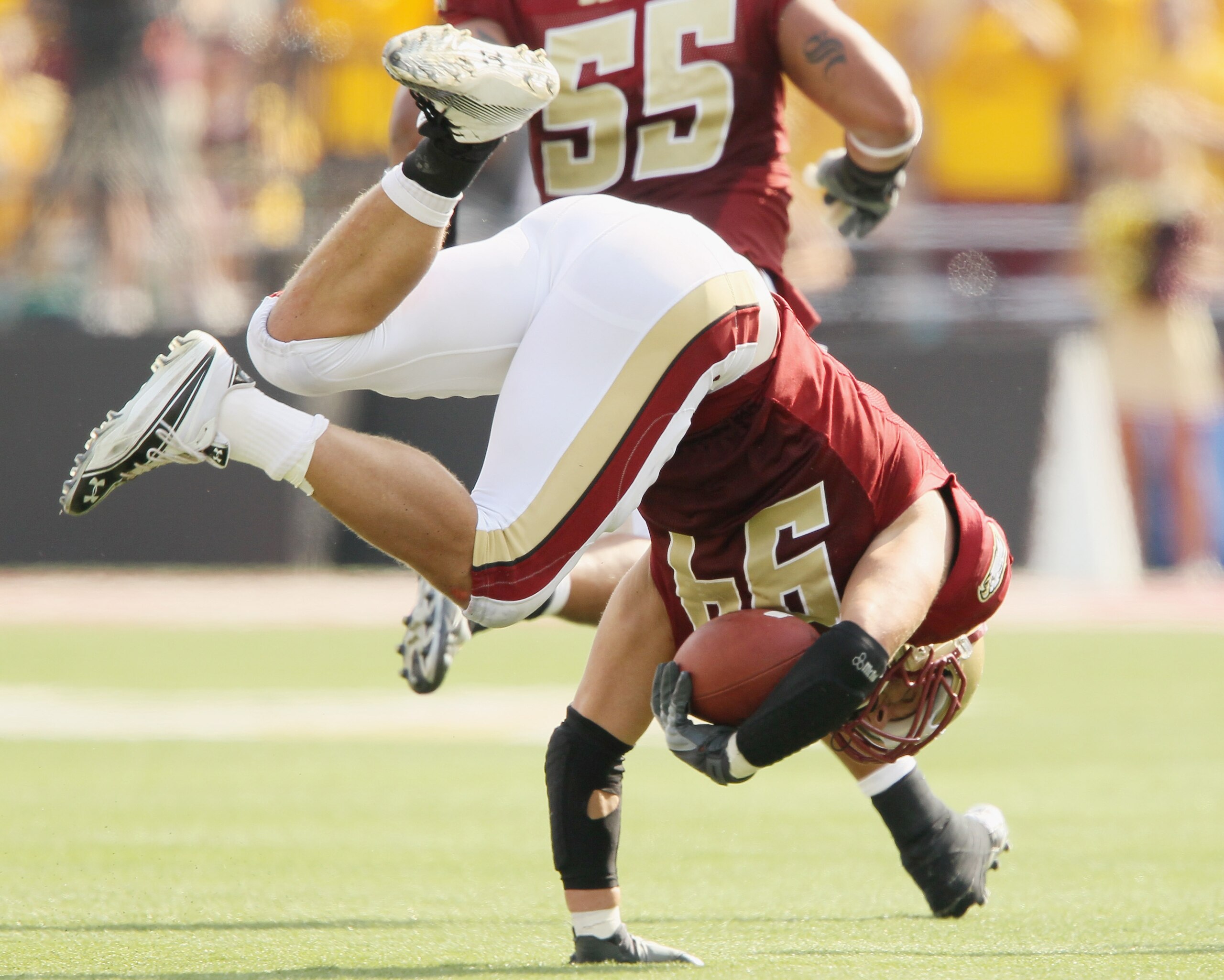CHESTNUT HILL, MA - SEPTEMBER 25: Mark Herzlich #94 of the Boston College Eagles falls after he intercepts a pass from Tyrod Taylor of the Virginia Tech Hokies on September 25, 2010 at Alumni Stadium in Chestnut Hill, Massachusetts. Virginia Tech defeate CHESTNUT HILL, MA - SEPTEMBER 25: Mark Herzlich #94 of the Boston College Eagles falls after he intercepts a pass from Tyrod Taylor of the Virginia Tech Hokies on September 25, 2010 at Alumni Stadium in Chestnut Hill, Massachusetts. Virginia Tech defeate